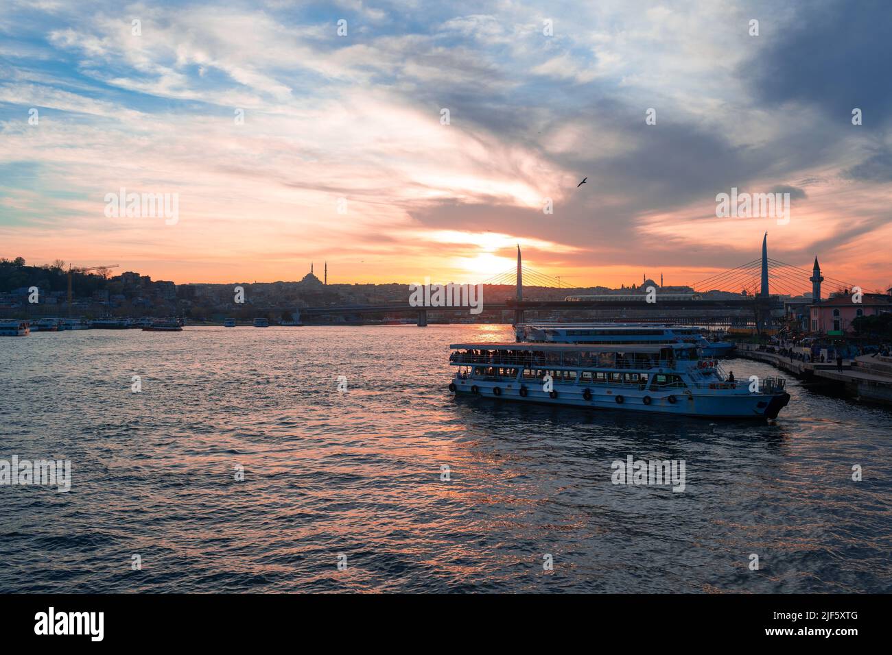 Boats in sea and scenic sunset in Istanbul Stock Photo