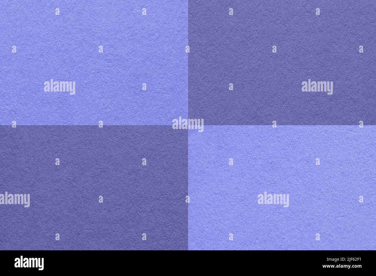 Texture of craft blue and violet paper background with cells pattern, macro. Structure of vintage dense kraft very peri cardboard. Felt abstract check Stock Photo