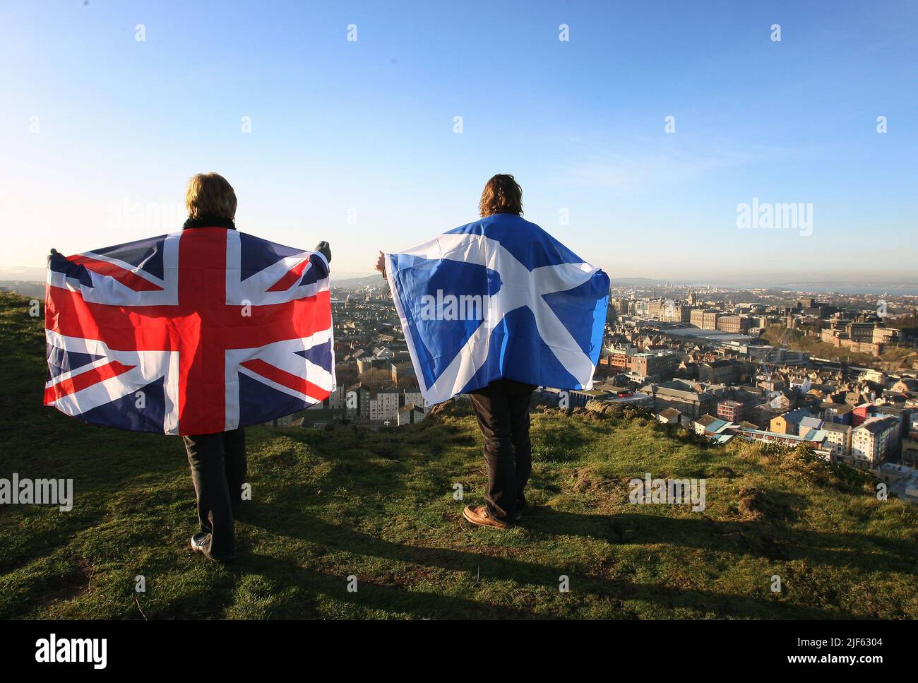 File photo dated 13/01/12 of Scottish and English flags held up over Edinburgh, Scotland, as more than half of people in Scotland do not want another independence referendum next year, according to a new poll. First Minister Nicola Sturgeon has announced plans for a second vote on the issue on October 19 2023. Stock Photo