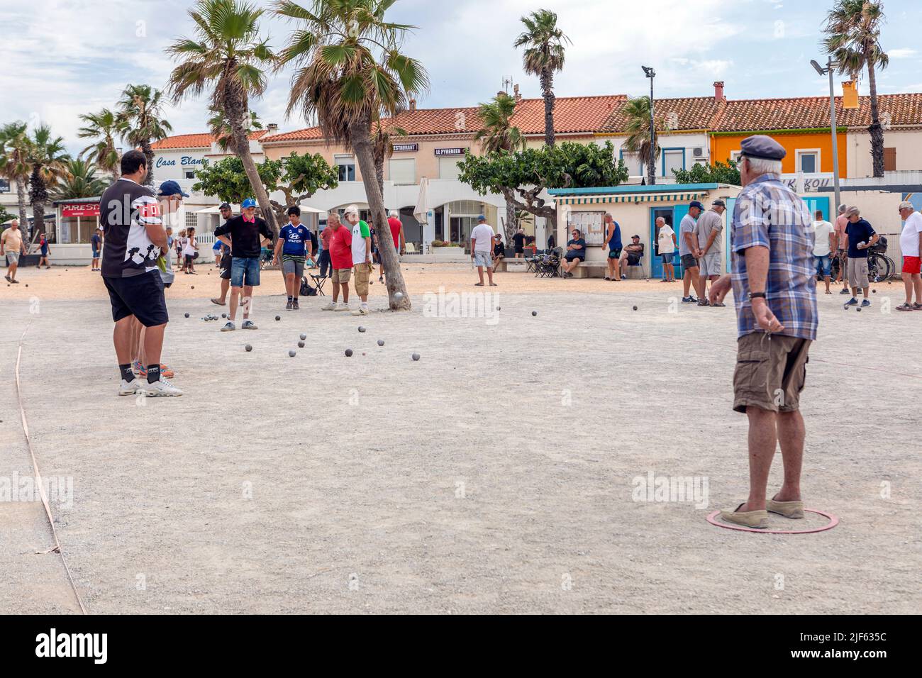 French people playing boules in Barcares Village square Stock Photo
