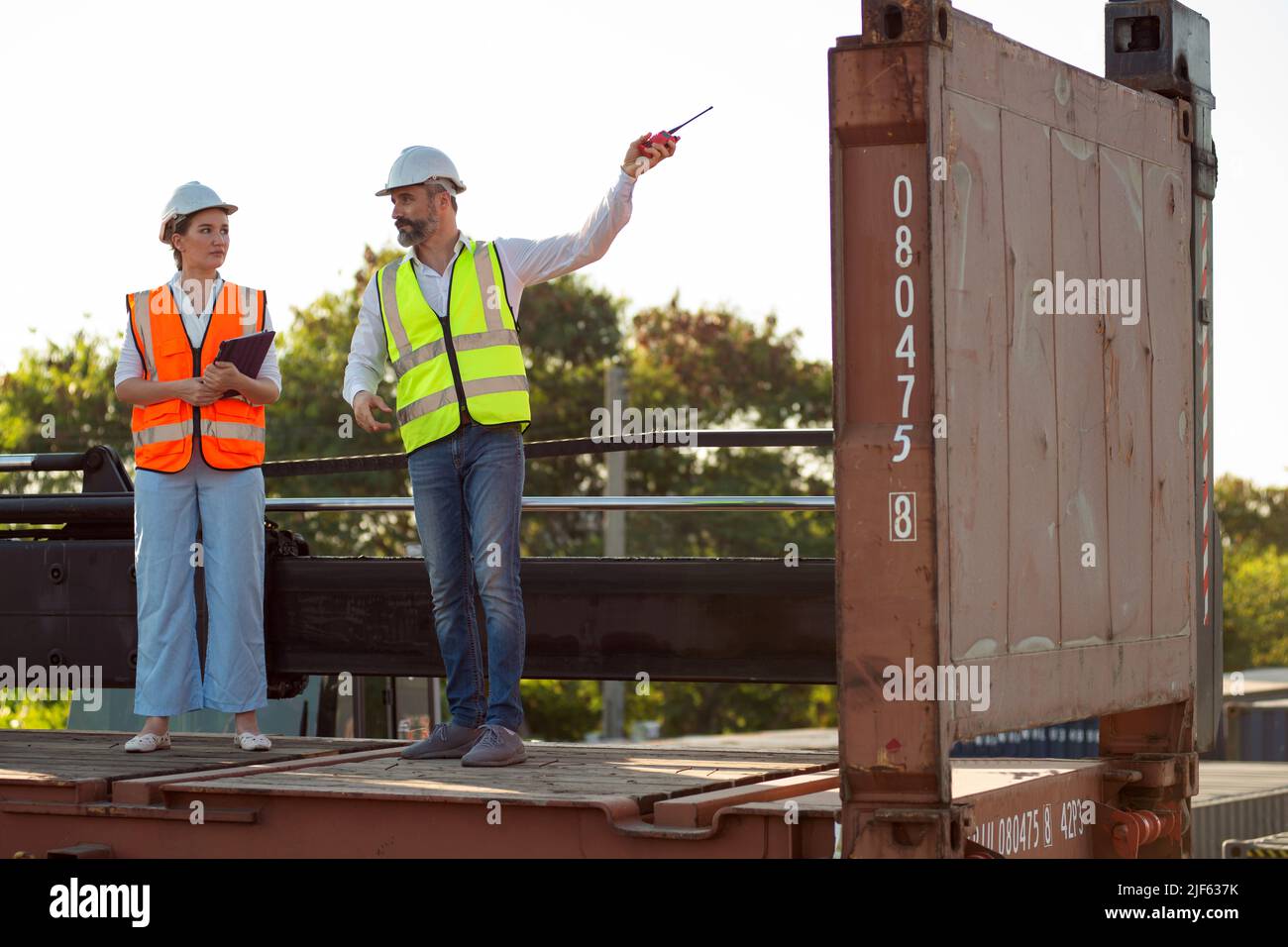 Male and female manager discuss and checking about their job for shipment to customer. Distribution storage commerce port cargo. Stock Photo