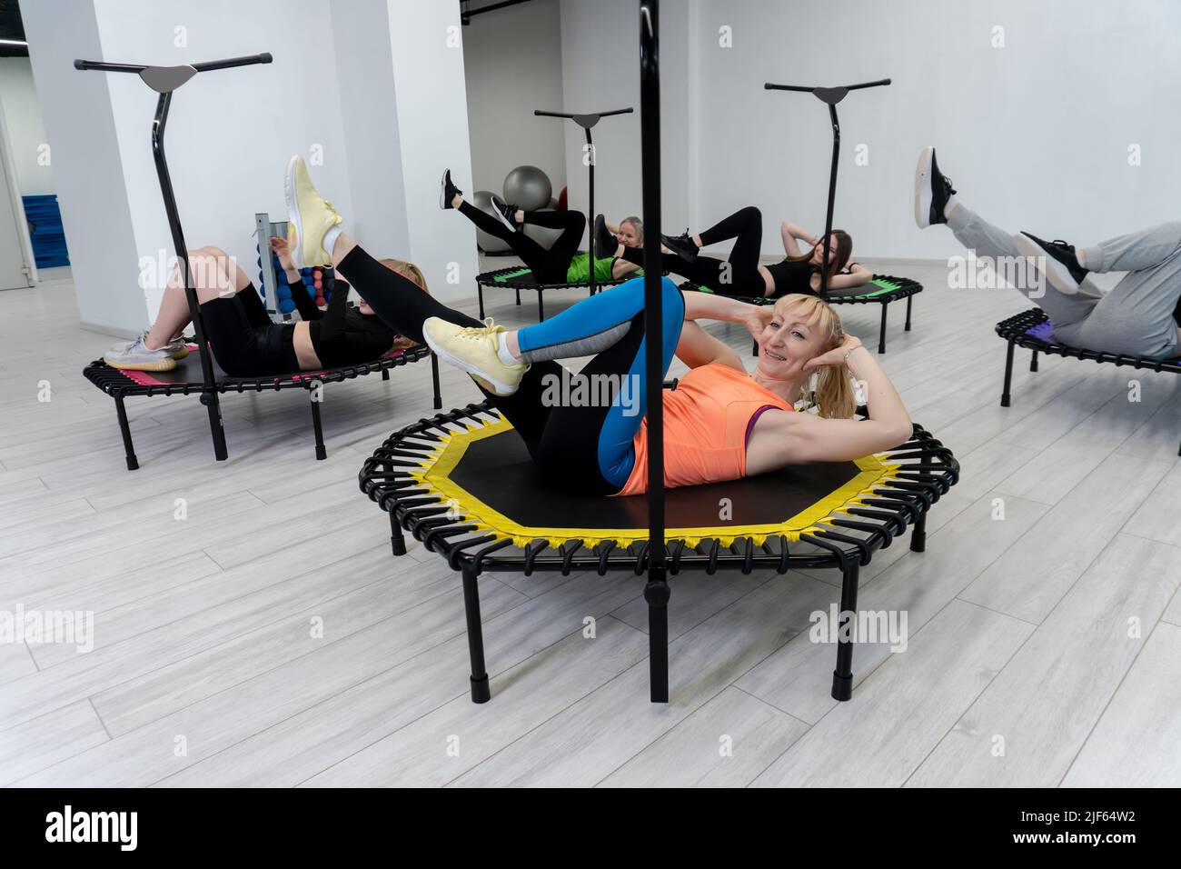 Lie down trampoline active fitness group center friends youth athlete activity, concept training athletic from exercise from gym happiness, class Stock Photo