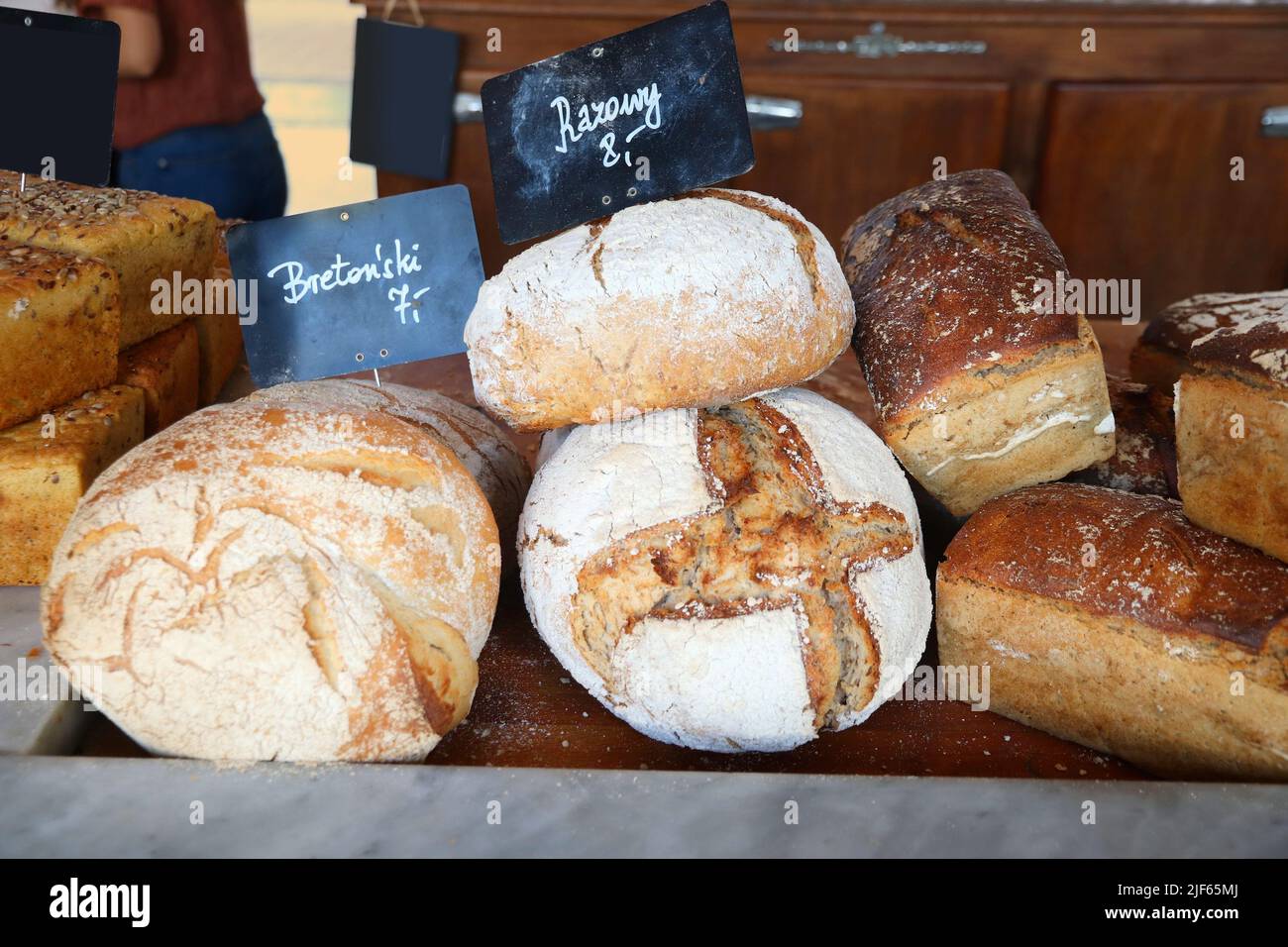 Artisanal bakery products in Poland. French style Breton bread (Polish language: Bretonski) and rye sourdough bread (Polish language: Razowy). Stock Photo