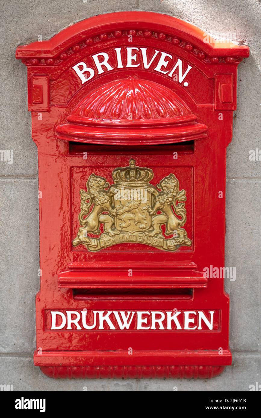 Enkhuizen, Netherlands. June 2022. Old mailbox and announcements at the post office. High quality photo Stock Photo