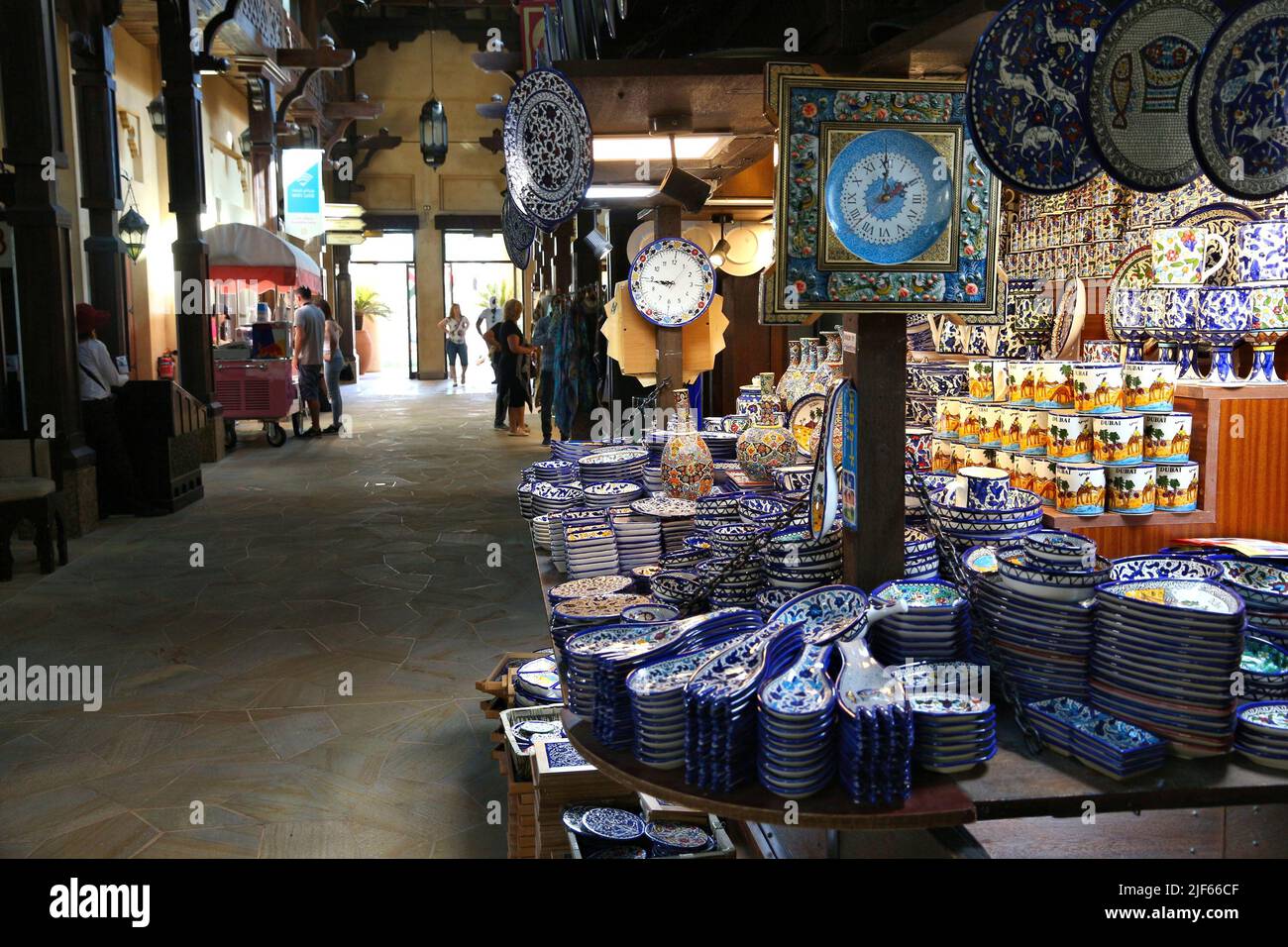 DUBAI, UAE - NOVEMBER 23, 2017: Tourists visit handicraft shops at Souk Madinat Jumeirah in Dubai. The traditional Arab style bazaar is part of Madina Stock Photo