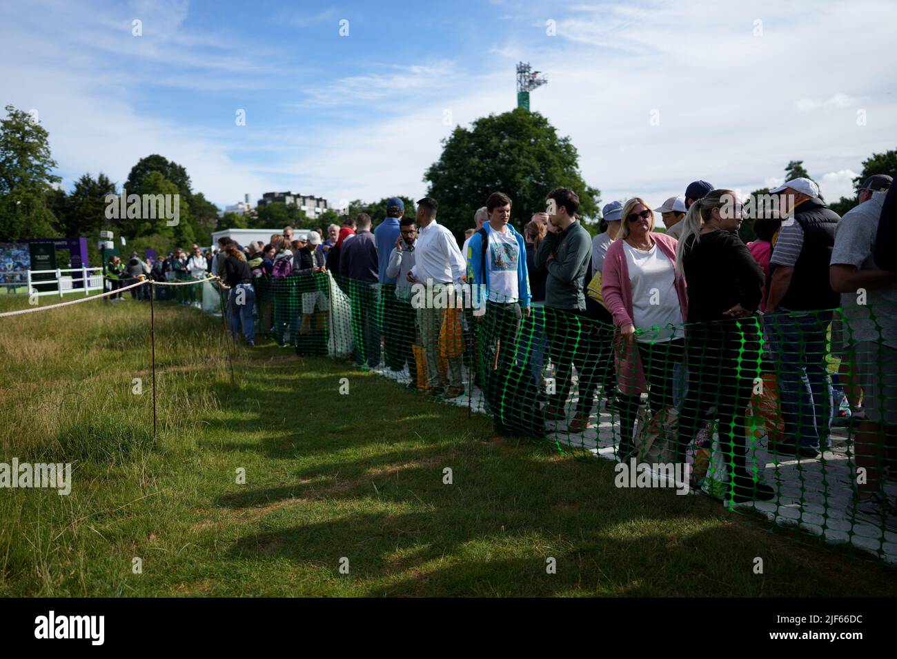 A general view of spectators queueing before play on day four of the