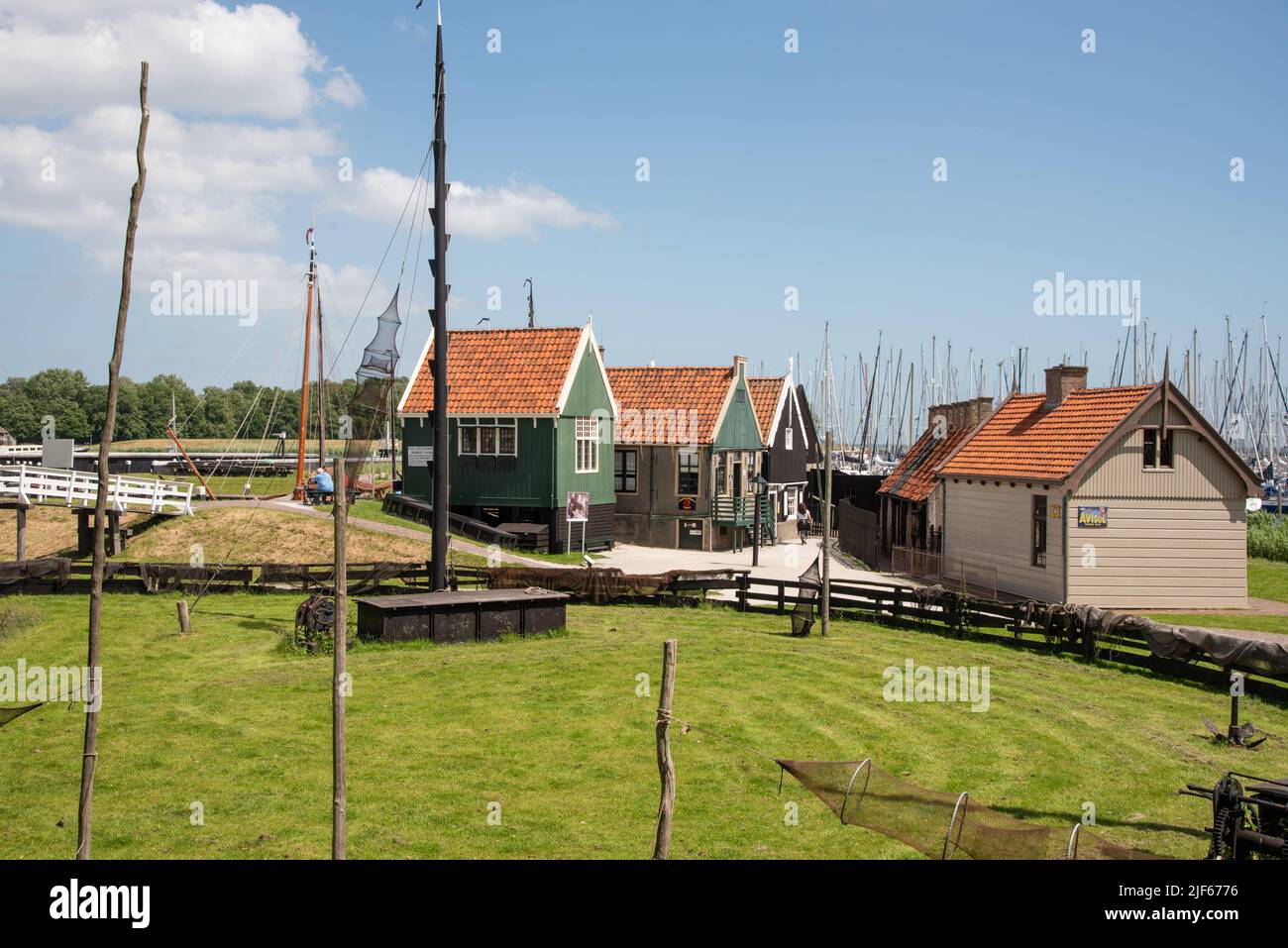 Enkhuizen, Netherlands. June 2022. Fisherman's cottage at the harbour with traditional fishing boats in Enkhuizen. High quality photo Stock Photo