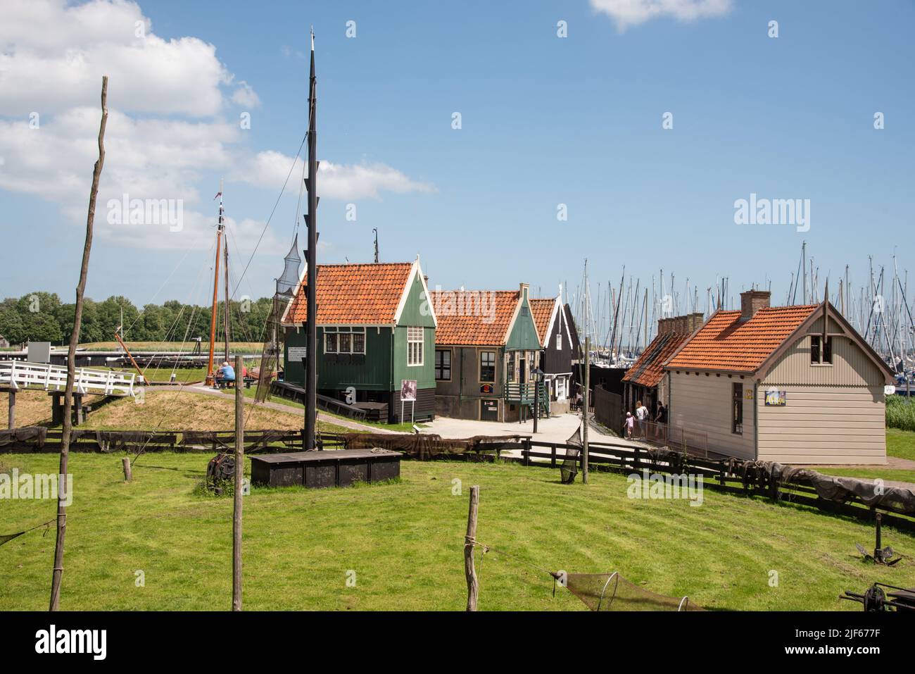 Enkhuizen, Netherlands. June 2022. Fisherman's cottage at the harbour with traditional fishing boats in Enkhuizen. High quality photo Stock Photo