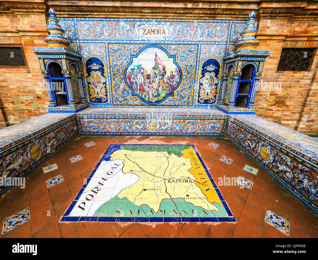 Detail of the tiled spanish province of Zamora alcove along the walls of Plaza de Espana building - Seville,  Spain Stock Photo