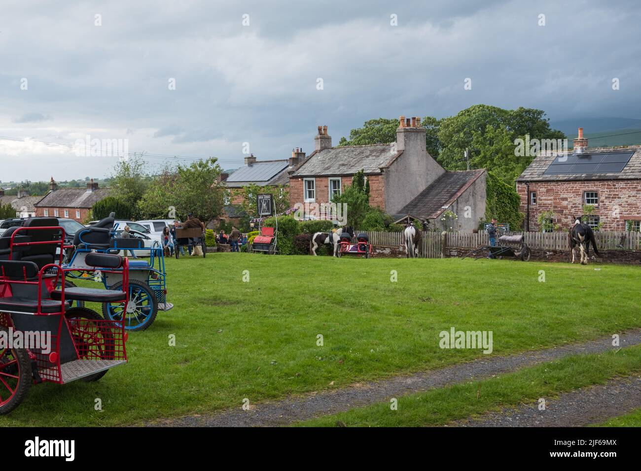 Gypsies and the horse and traps at the Appleby Horse Fair visiting the village of Dufton near Appleby-in-Westmorland, Cumbria Stock Photo
