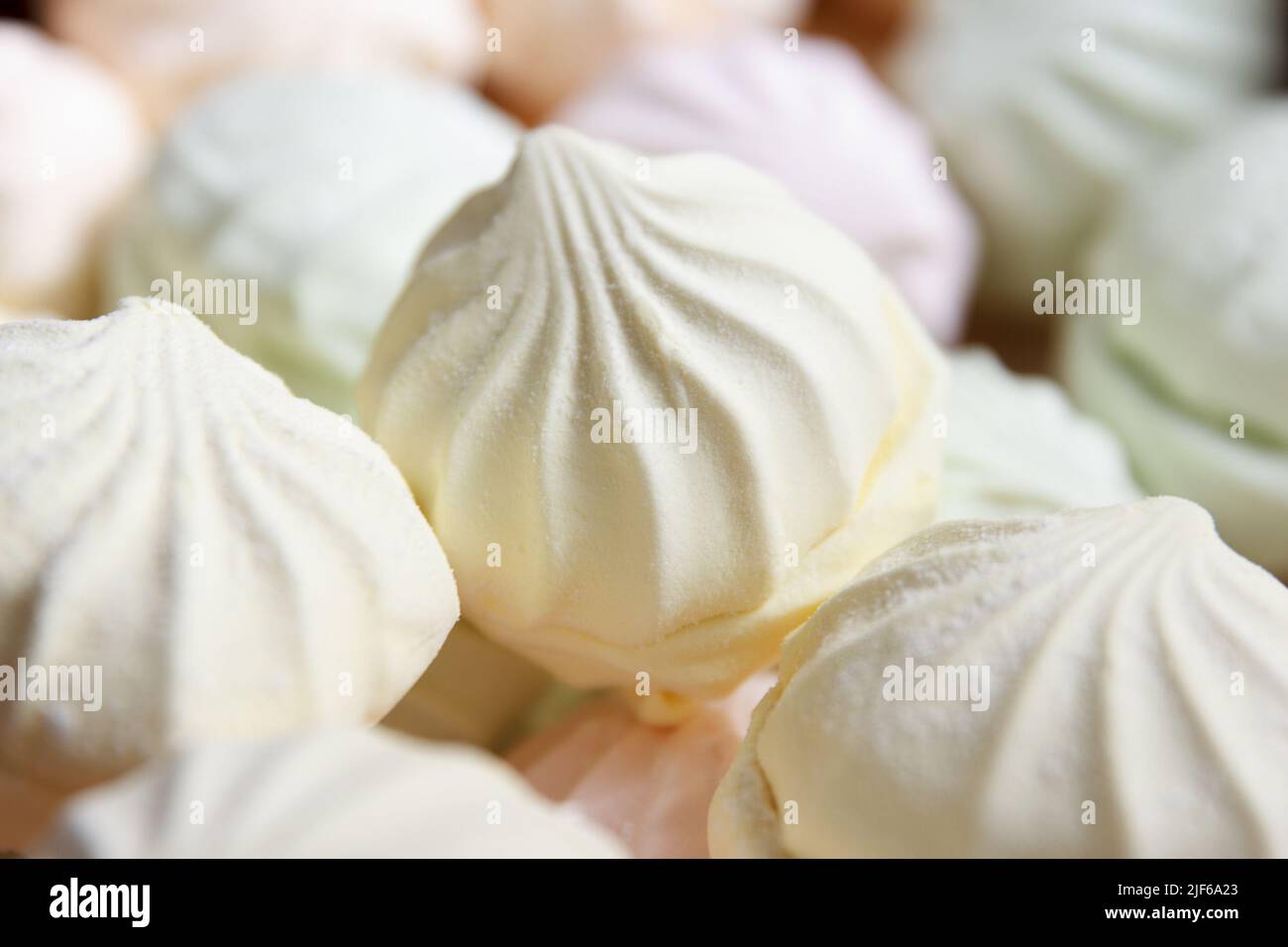 Freshly prepared packaged multicolored air marshmallow according to a classic recipe at a confectionery factory, lies for sale to customers Stock Photo