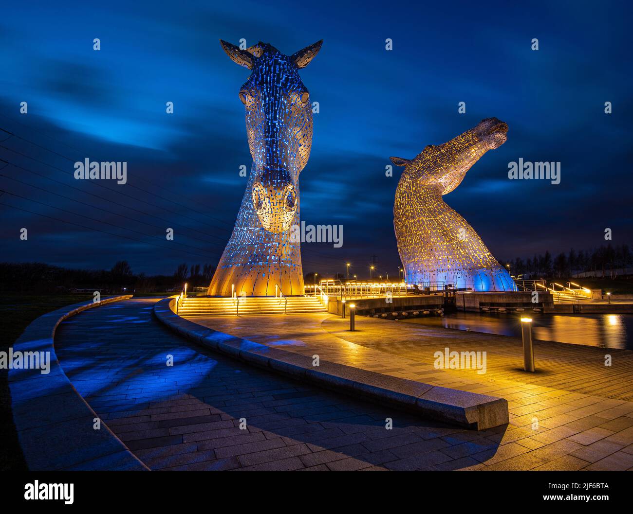 The Kelpies are 30-metre-high horse-head sculptures by artist Andy Scott and are located in Helix Park Falkirk next to the Forth and Clyde Cana Stock Photo