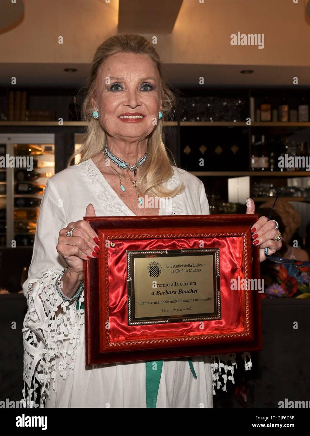 Milan, Italy. 30th June, 2022. Milan, Italy Barbara Bouchet receives the  Career Award from the Milanese Amici della Lirica Association delivers the  plaque Attilio Fontana President of the Lombardy Region with Daniela