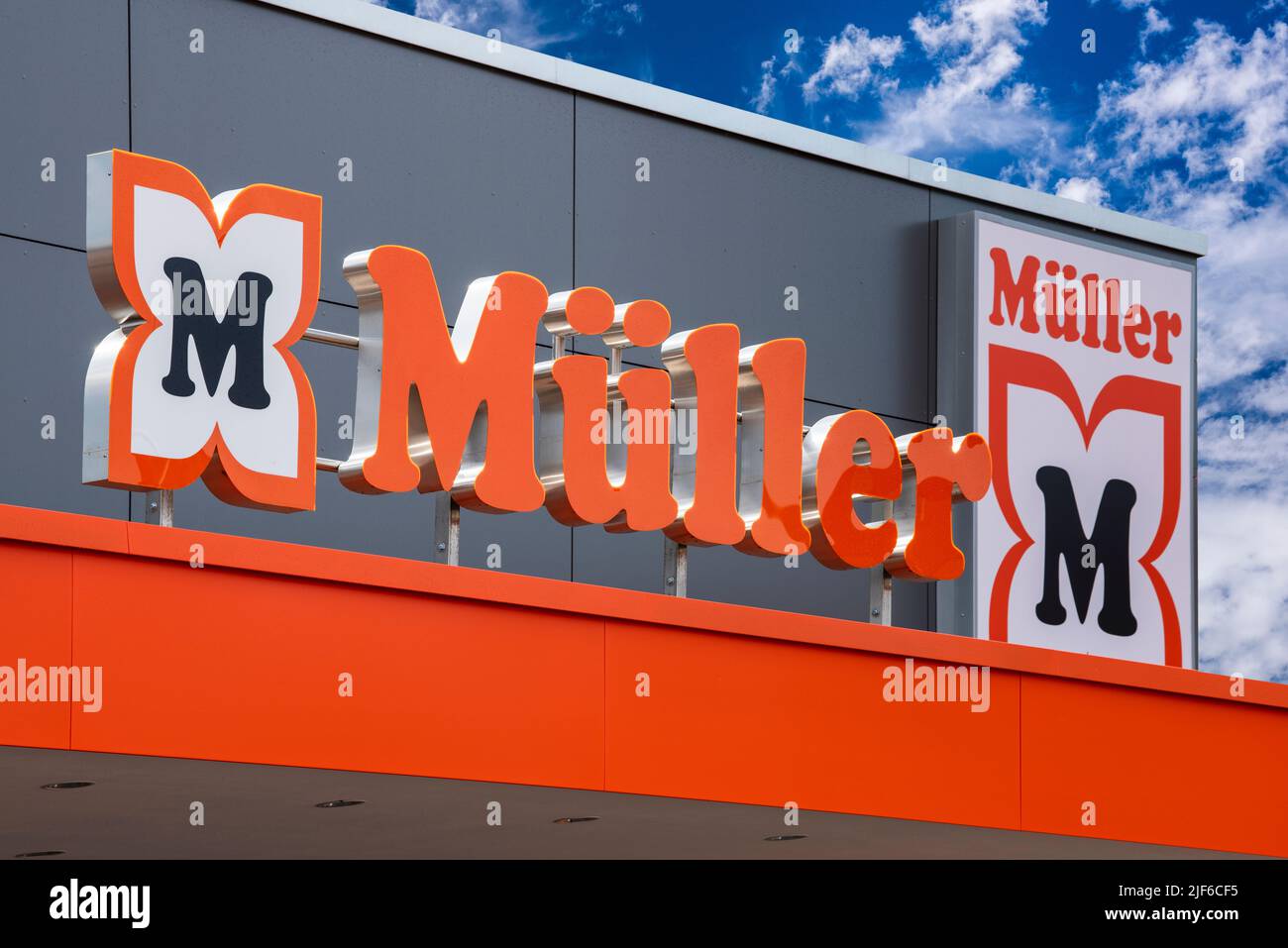 AUGSBURG, GERMANY – JUNE 16, 2022: Advertising sign of the drugstore Müller in front of a sky with clouds Stock Photo