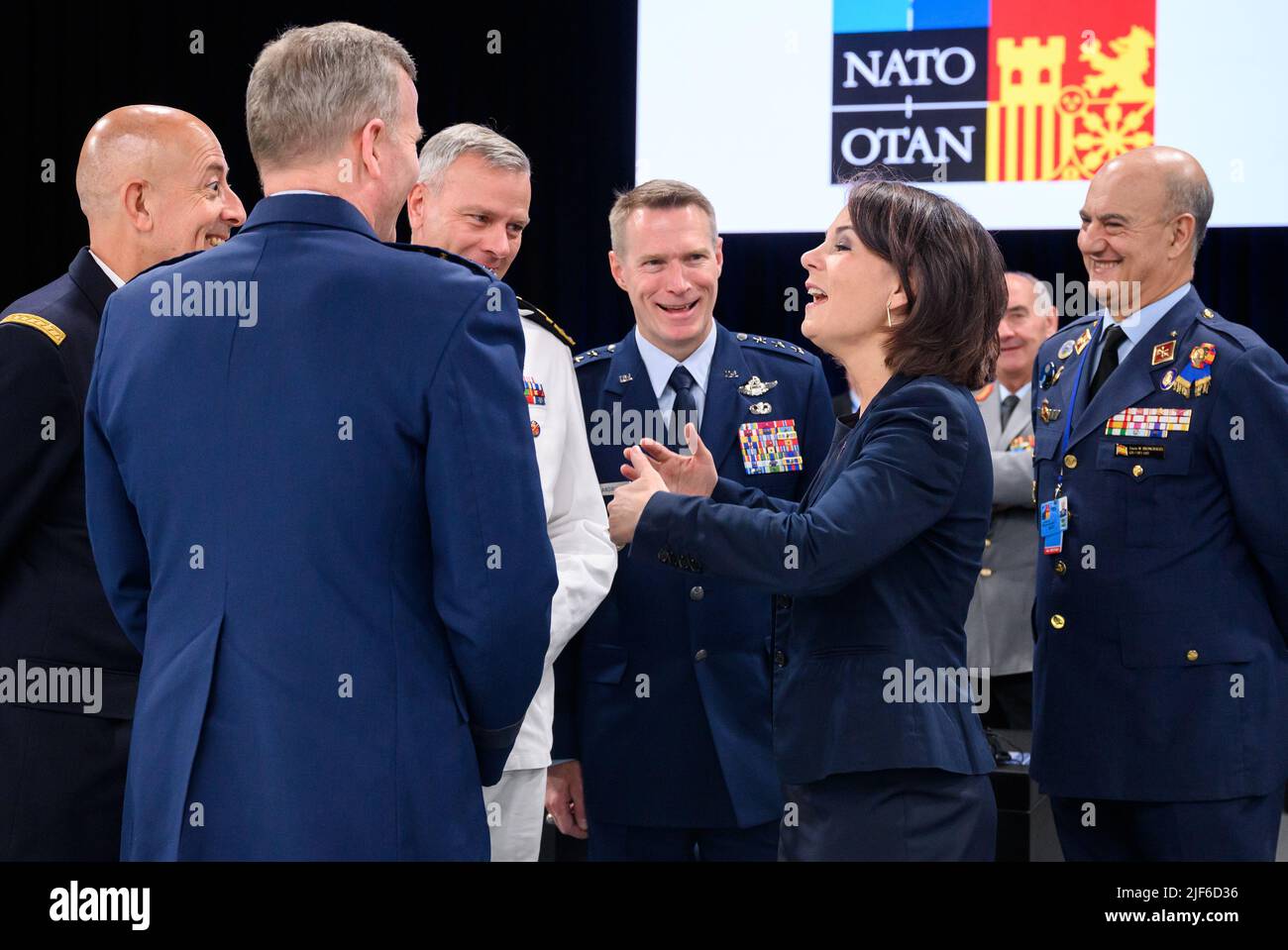 30 June 2022, Spain, Madrid: Annalena Baerbock (Bündnis 90/Die Grünen), Foreign Minister, talks with the senior Nato generals (l-r), General Philippe Lavigne, Supreme Allied Commander Transformation (Sact), General Tod D. Wolters, Supreme Allied Commander Europe (SACEUR), Admiral Rob Bauer, Chair of the Nato Military Committee, Lieutenant General Landrum, Deputy Chair of the Nato Military Committee, and Major General Lucas Muñoz Bronchales, SACT Representative in Europe. At the two-day summit, the heads of state and government of the 30 alliance countries took decisions on the implementation o Stock Photo
