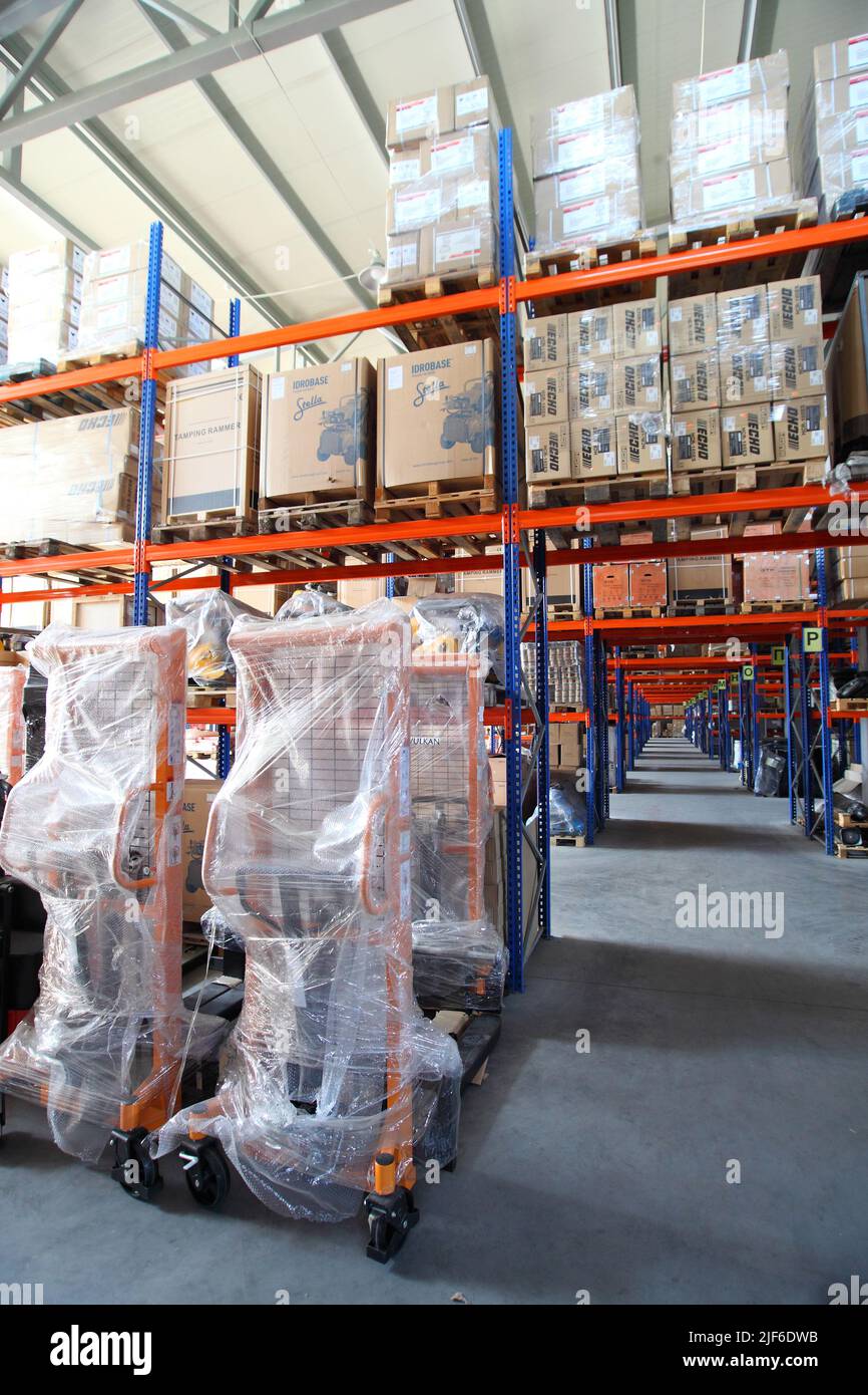 Goods and materials arranged on a rack in warehouse. Warehouse store