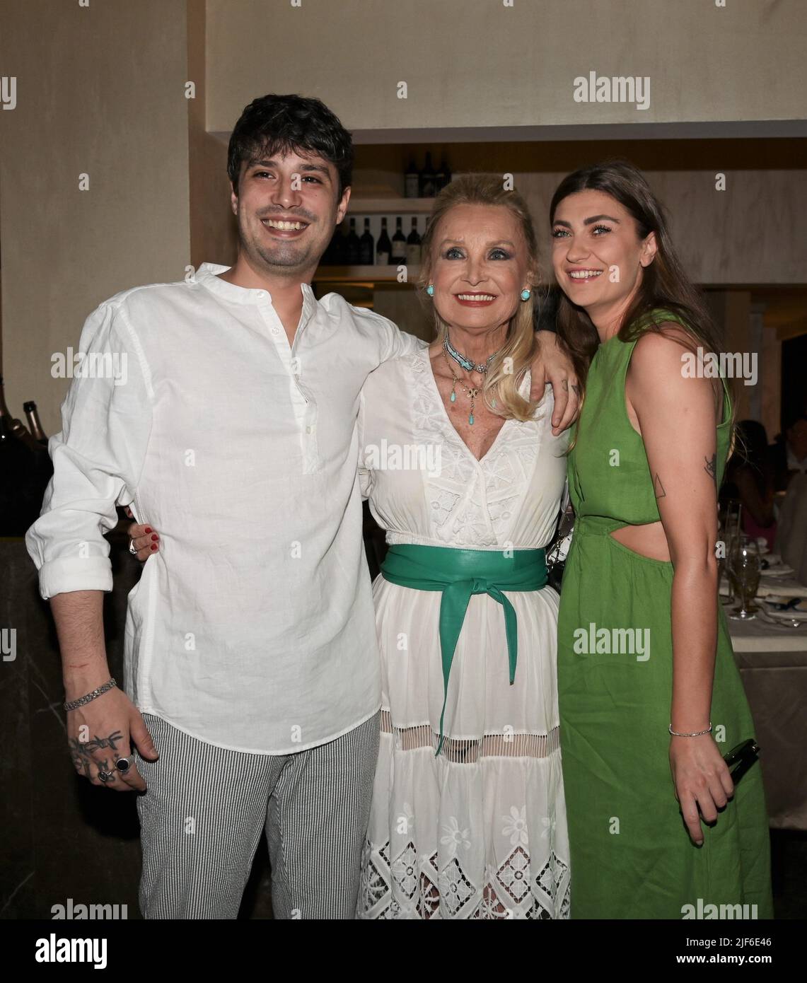 Milan, Italy. 30th June, 2022. Milan, Italy Barbara Bouchet receives the  Career Award from the Milanese Amici della Lirica Association delivers the  plaque Attilio Fontana President of the Lombardy Region with Daniela
