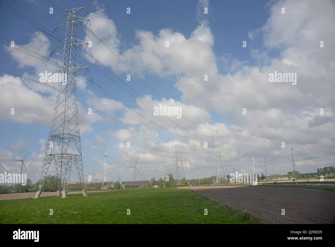 Electricity grid plylons with solar panels fitted for powering monitering equipment, Flanders, Belgium Stock Photo