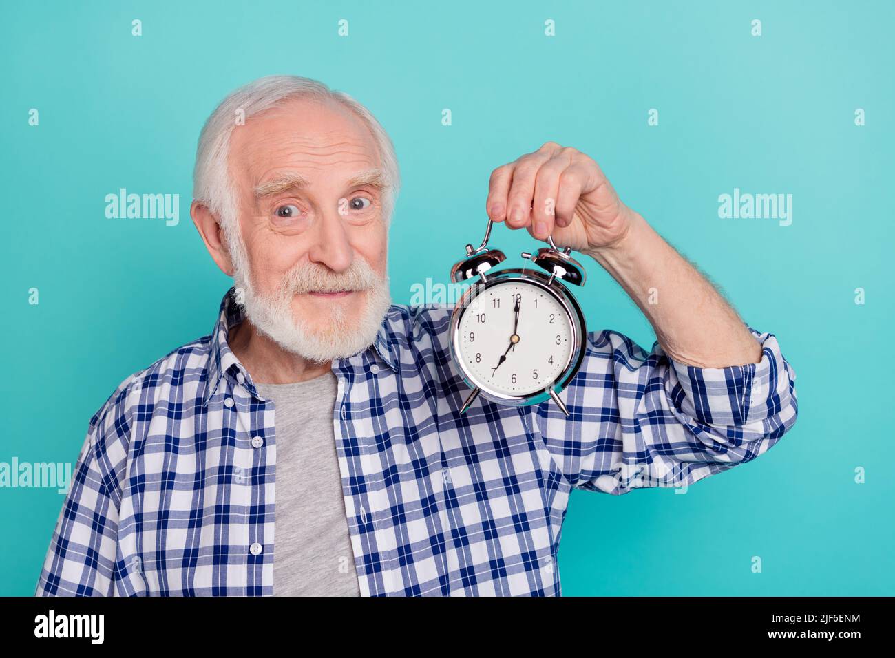 Remind Time Photo of positive friendly grandfather showing you metal clock remind ...