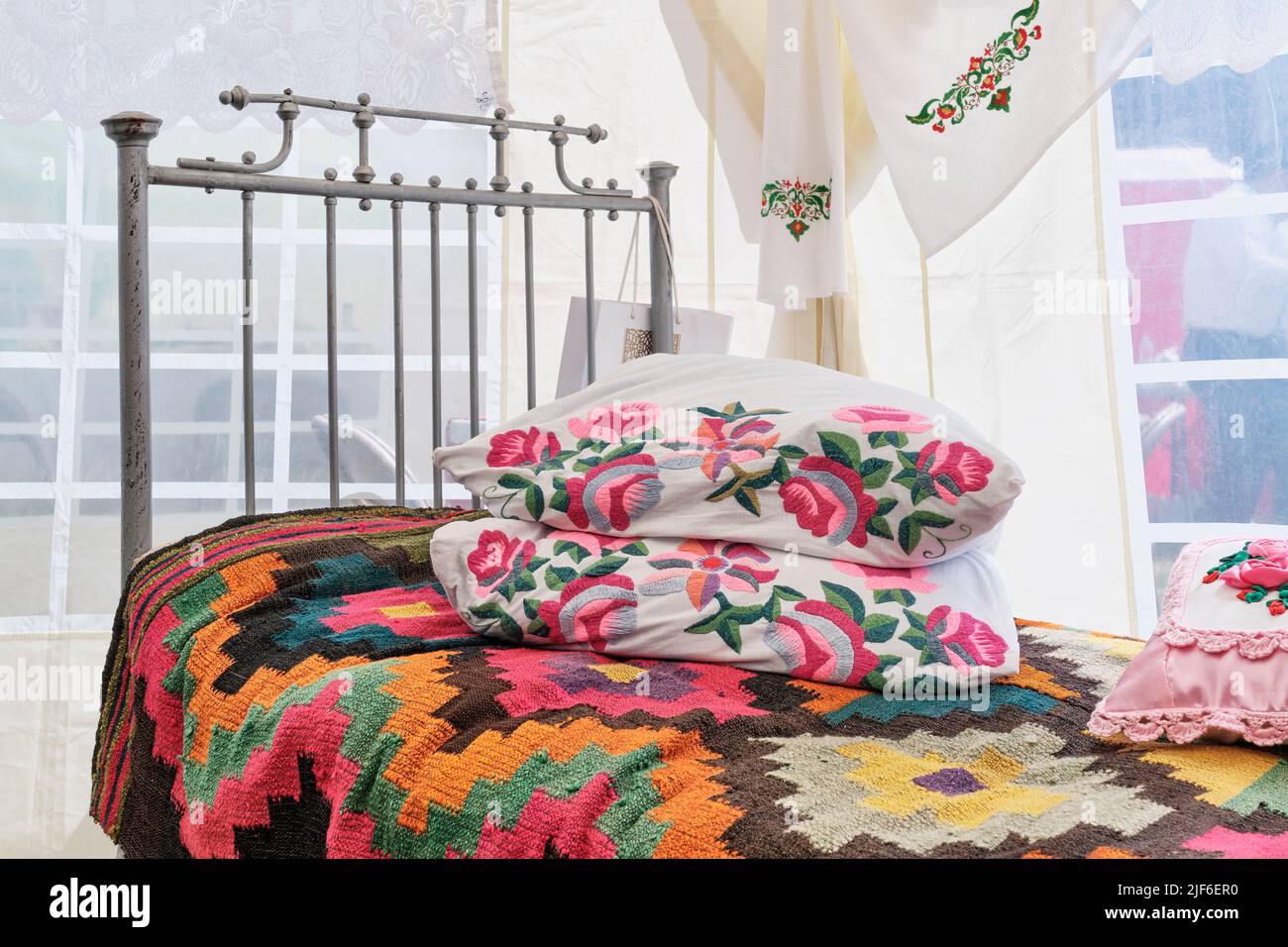 Traditional decor of bed in Tatar vintage style.Colorful bedspread
