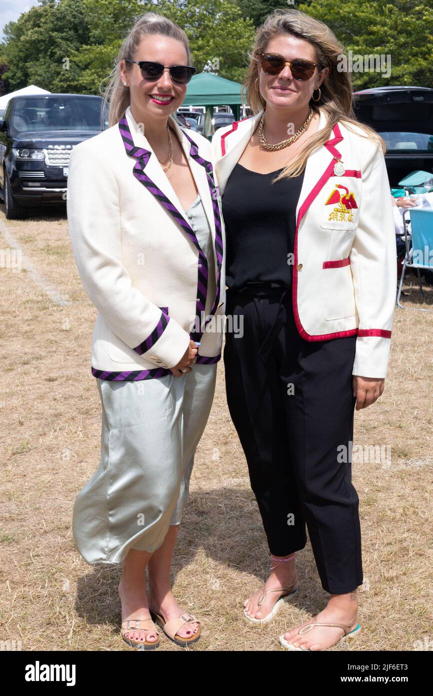 Henley, Oxfordshire, England, UK 29 June 2022 Day at Henley Royal Regatta. Girls wear the club colours of Leander and MRC Stock Photo