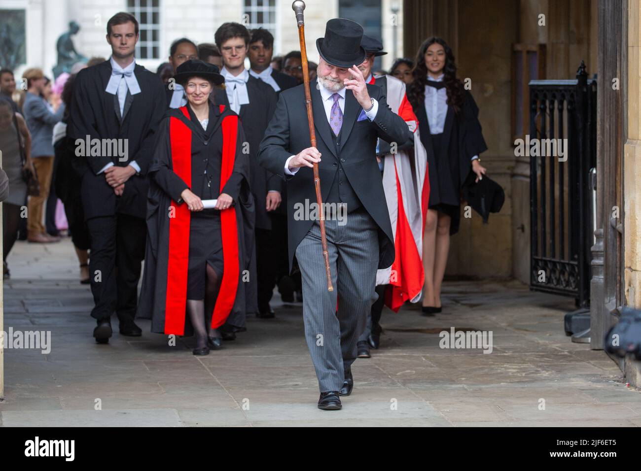 Picture dated June 29th shows students from King’s College Cambridge on their Graduation Day on Wednesday morning as the full ceremonies return after covid restrictions.   Students dressed in black gowns as the traditional Cambridge University graduation ceremonies took place in front of family and friends today (Wed) – after they had to watch on screens last year due to the Coronavirus pandemic. The students paraded into historic Senate House to collect their degrees from the prestigious university. Family and friends were able to watch the ceremony inside the Senate House, after having to wa Stock Photo