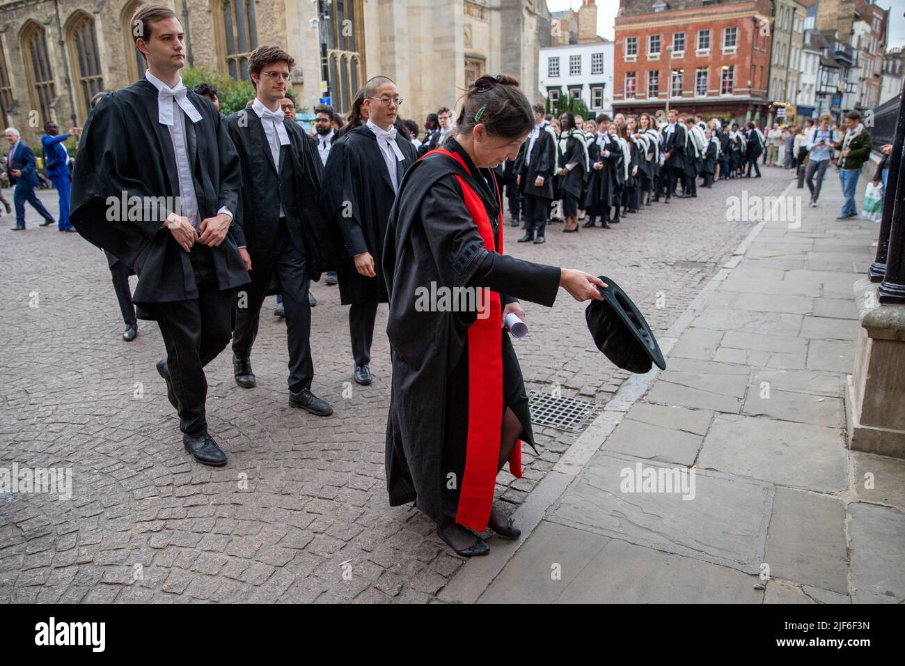 Picture dated June 29th shows students from King’s College Cambridge on their Graduation Day on Wednesday morning as the full ceremonies return after covid restrictions.   Students dressed in black gowns as the traditional Cambridge University graduation ceremonies took place in front of family and friends today (Wed) – after they had to watch on screens last year due to the Coronavirus pandemic. The students paraded into historic Senate House to collect their degrees from the prestigious university. Family and friends were able to watch the ceremony inside the Senate House, after having to wa Stock Photo
