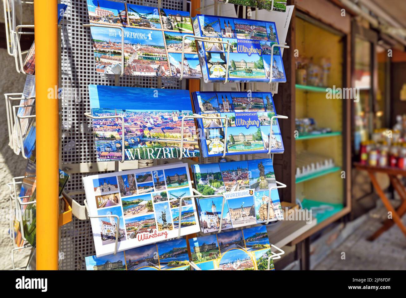 Würzburg, Germany - June 2022: Rack of postcards at souvenir shop in Würzburg Stock Photo