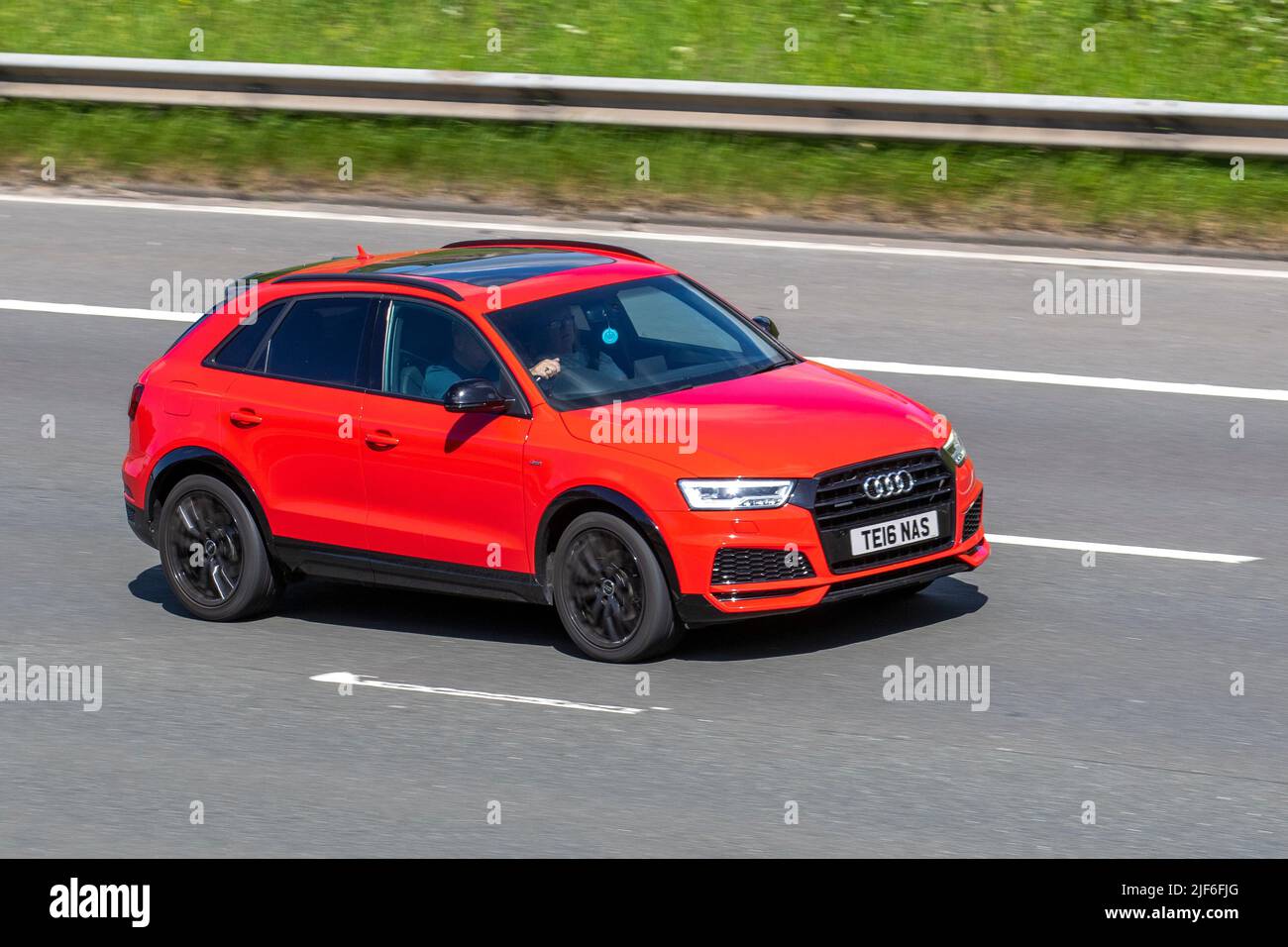 2017 red AUDI Q3 1968cc Diesel hatchback; travelling on the M61 Motorway, Manchester, UK Stock Photo