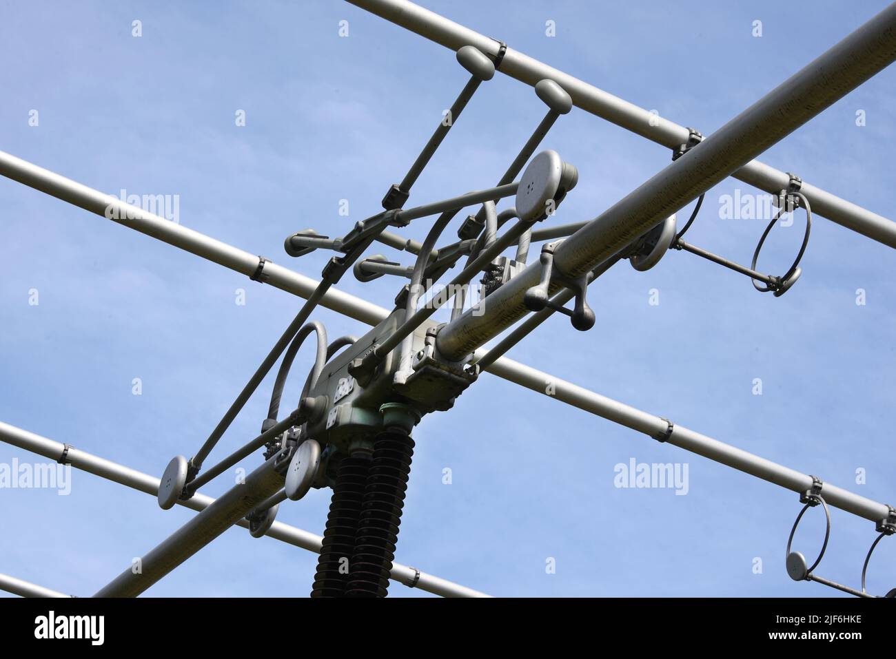22 June 2022, Saxony-Anhalt, Bad Lauchstädt: Installations from the Bad Lauchstädt substation stand out against the blue sky. The substation is one of over 70 electricity hubs operated by the transmission system operator 50Hertz in eastern Germany and needs to be expanded in the course of the energy transition. In order to collect electricity from renewable energies, transform it to a higher voltage level and transport it to other regions via extra-high voltage lines, two so-called STATCOMs. are being built here. The high-tech facilities are intended to keep the voltage in the power grid at a Stock Photo