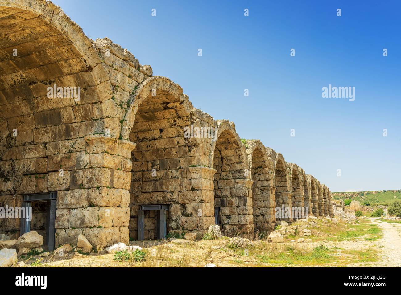 Arches of stadium outer wall built in 2nd century AD in Perge, an ancient Greek city in Anatolia, now in Antalya Province of Turkey. Stock Photo