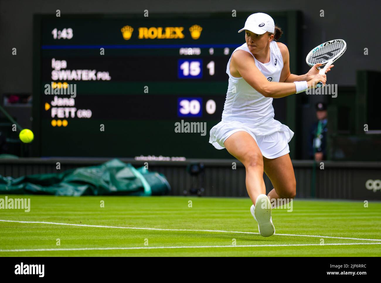 Iga Swiatek of Poland in action against Jana Fett of Croatia during the first round of the 2022 Wimbledon Championships, Grand Slam tennis tournament on June 28, 2022 at All England Lawn