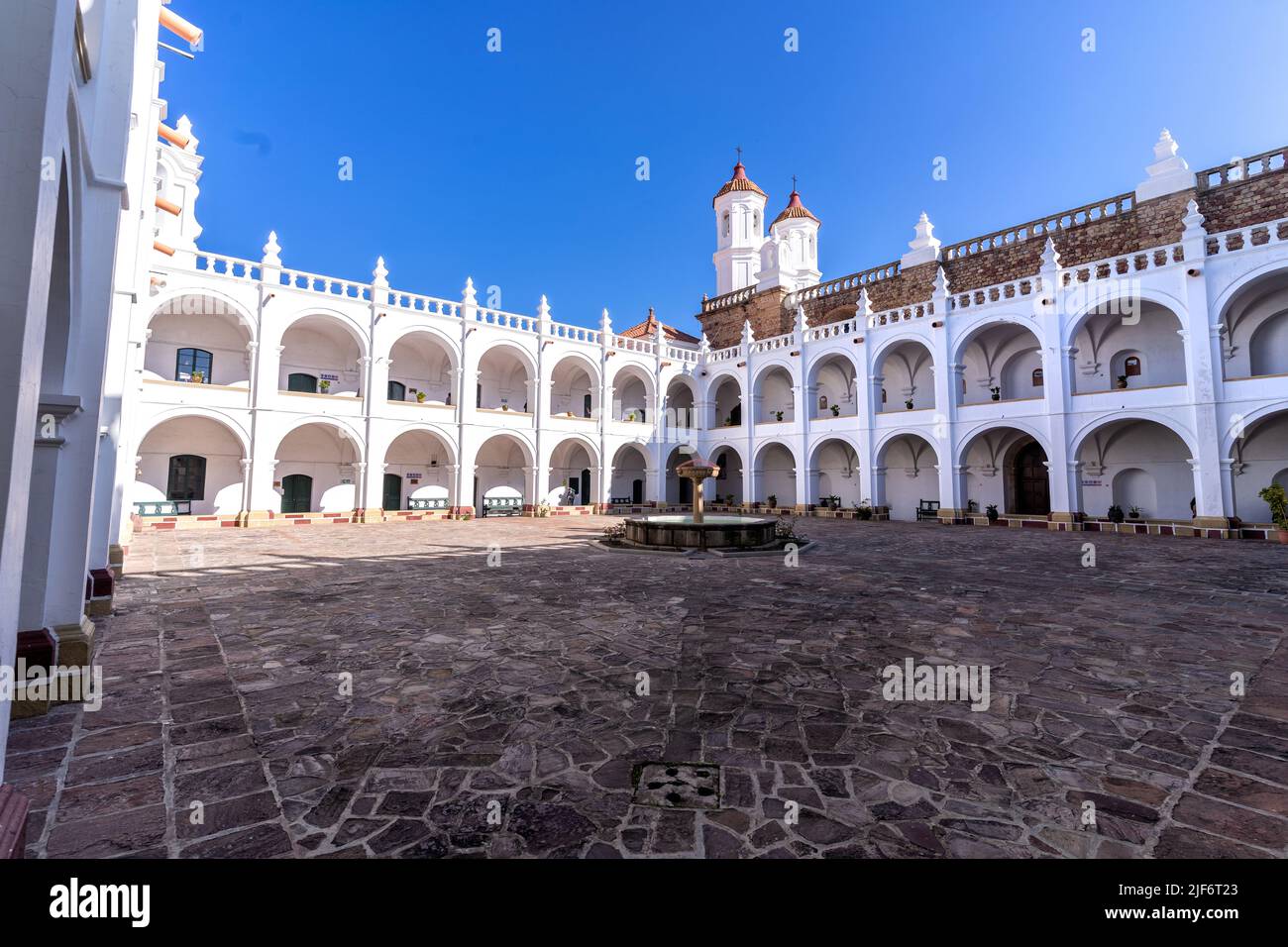 From above of ancient Templo de San Felipe Neri with fountain in courtyard and arched passages