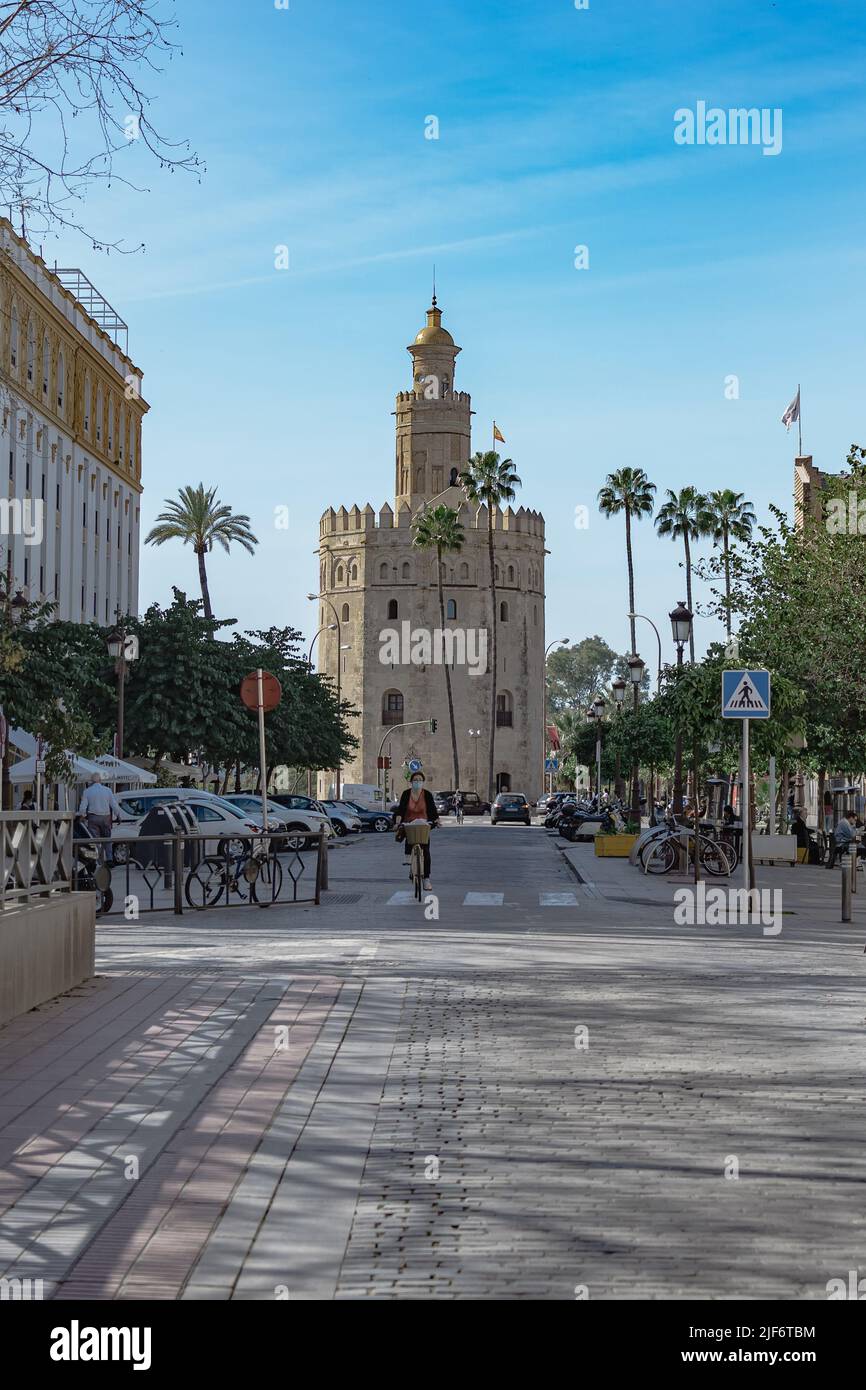 Seville, Spain, July 11 2021: Vertical shot, of the Torre del Oro, perspective from the Puerta de Jerez in Seville. Stock Photo