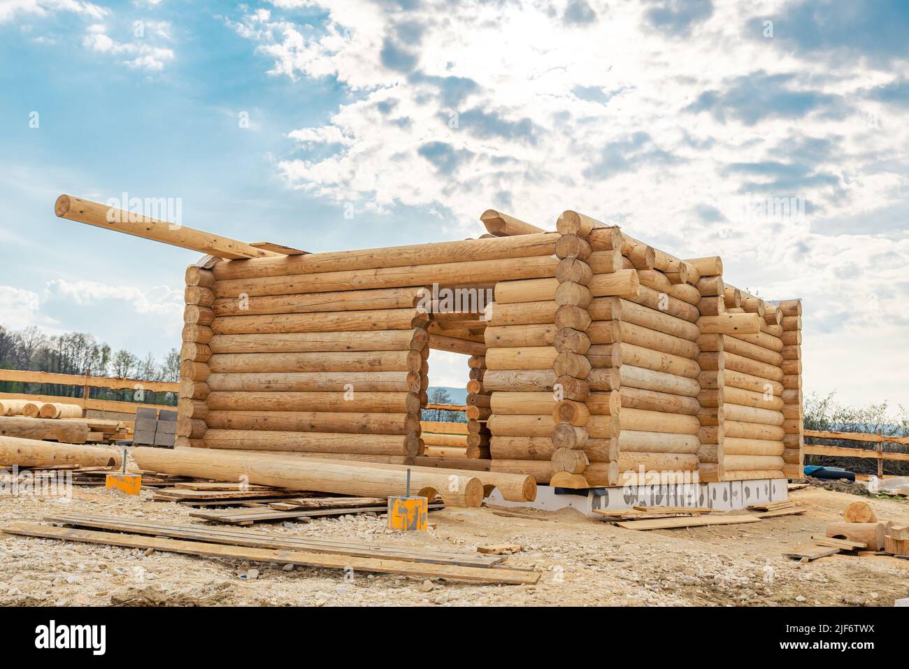 Construction site of wooden mountain house. Traditional log cabin built ...