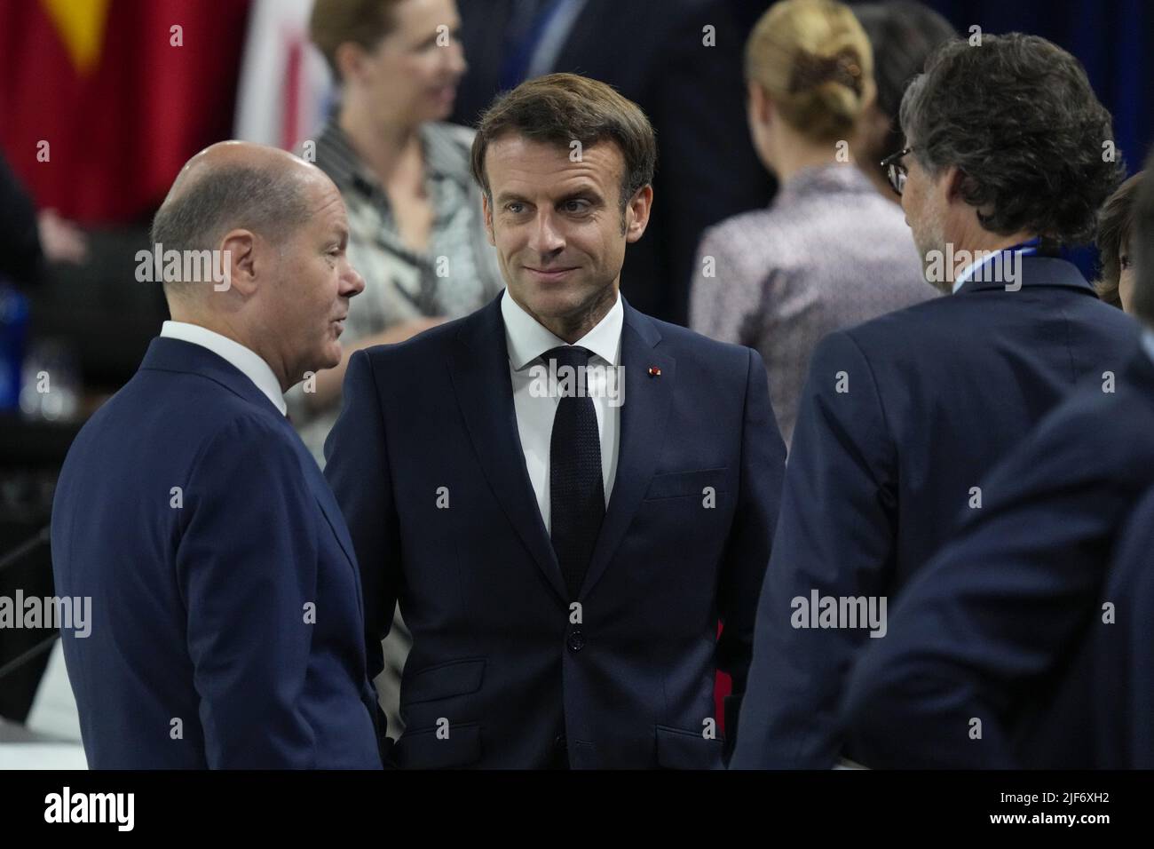 Madrid, Spain. 30th June, 2022. German Chancellor Olaf Scholz (L) speaks to French President Emmanuel Macron during a NATO heads of state and governments meeting on the final day of a NATO summit in Madrid, Spain, Thursday, June 30, 2022. Photo by Paul Hanna/UPI Credit: UPI/Alamy Live News Stock Photo
