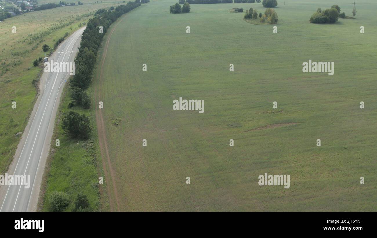 Asphalt road between rural fields in Ural, Russia. Beautiful summer ...
