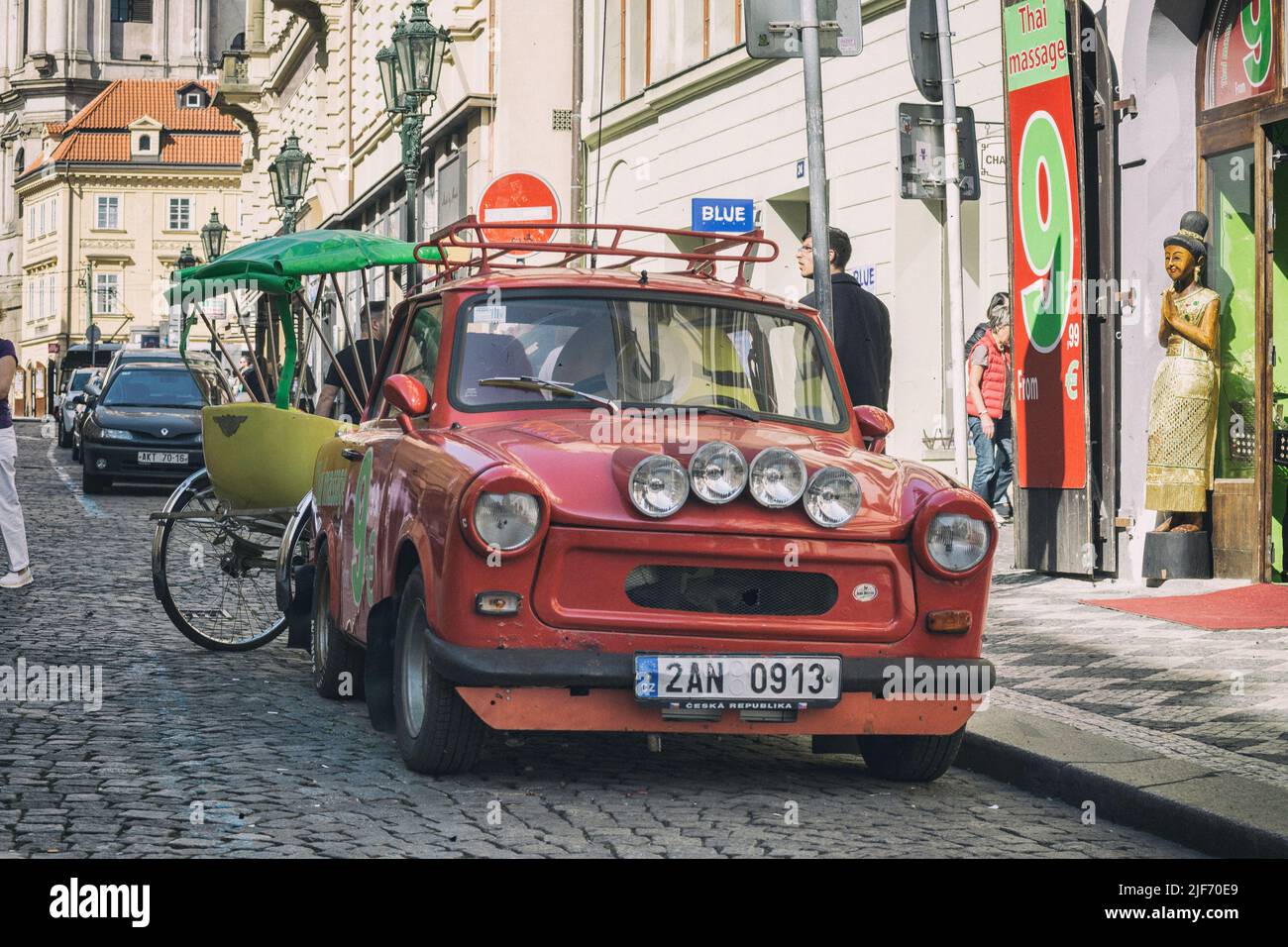 Old custom red mini car parked in the street. Trabant 601 Stock Photo