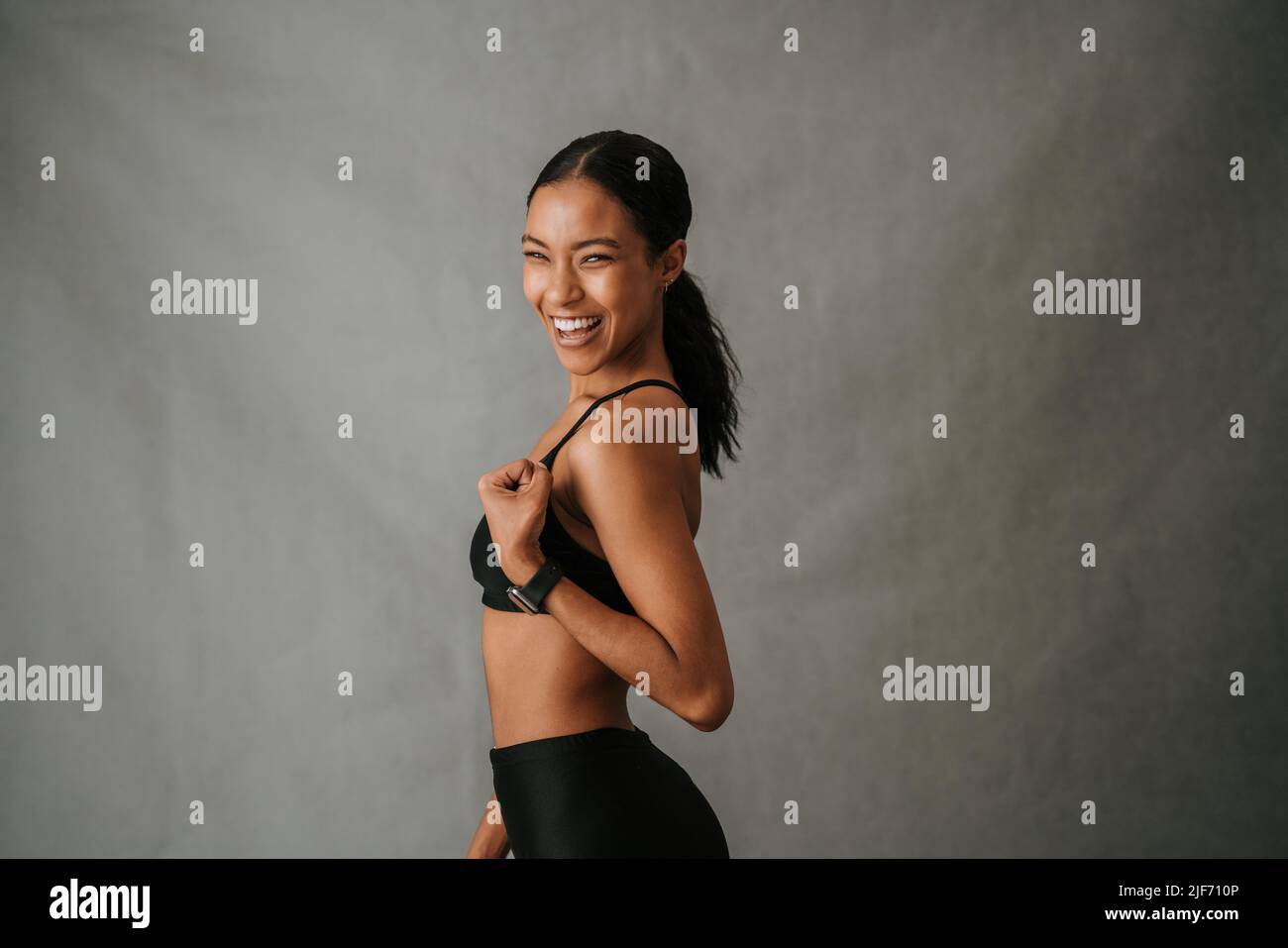 Close up of multi ethnic female doing an arm flexing exercise Stock Photo