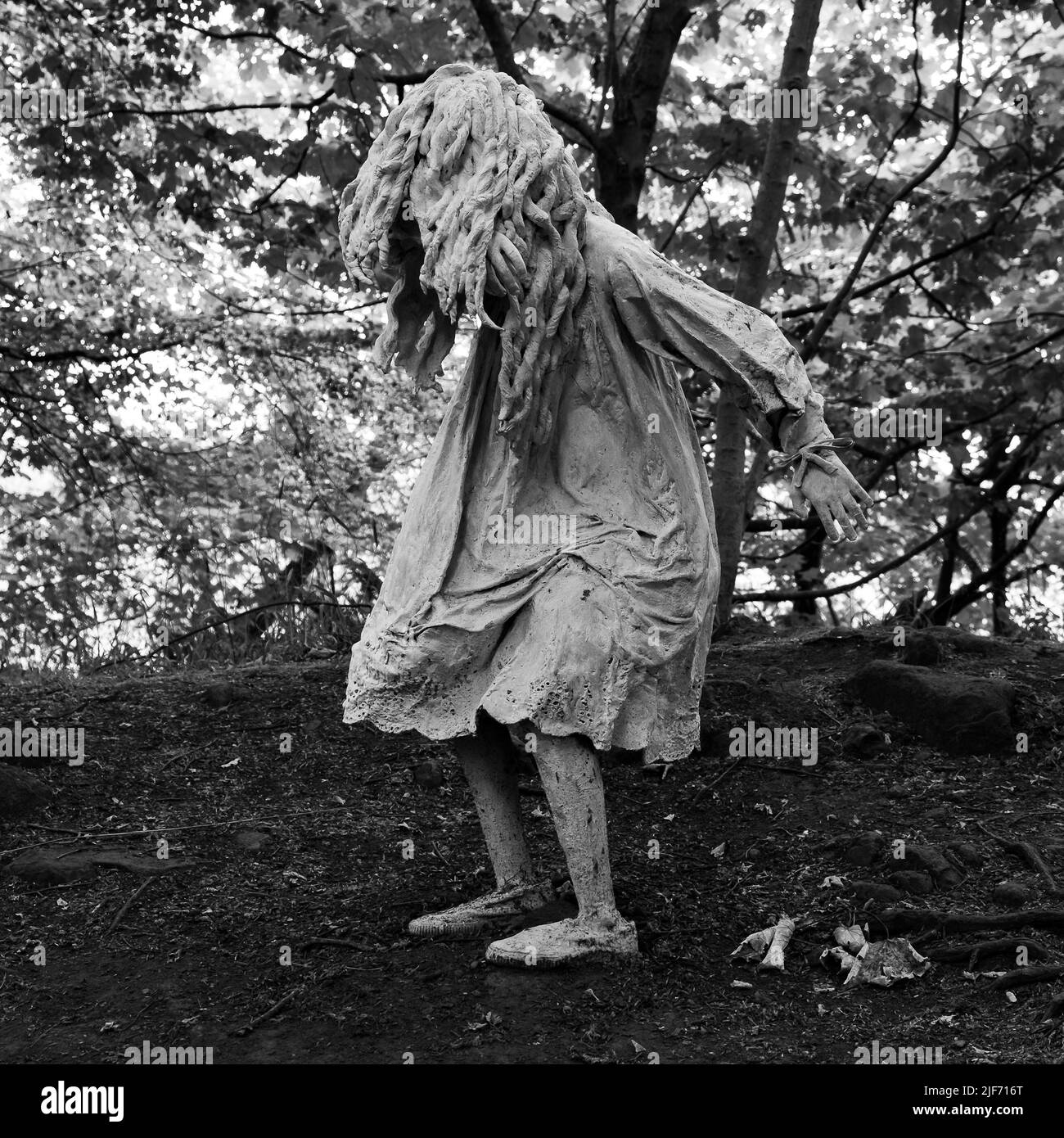 Weeping girl sculpture by Laura Ford taken at Jupiter Artland, Lothian Stock Photo