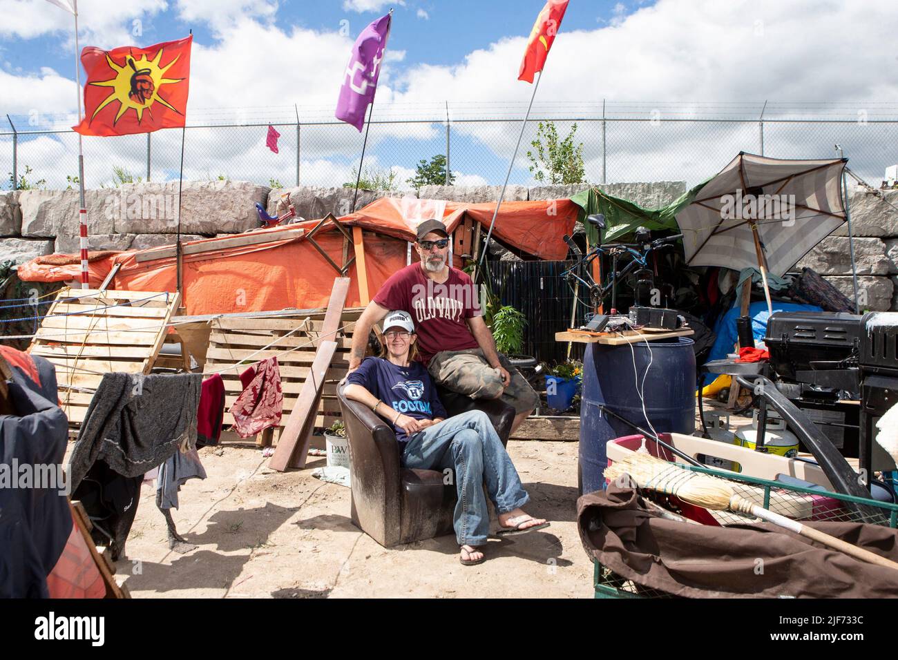 Will House and Jen Draper are photographed outside their home at a ...