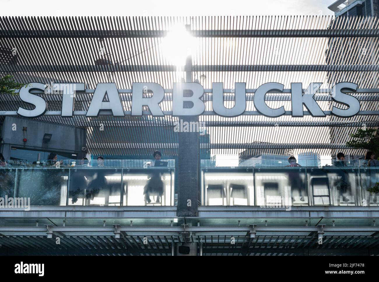 Customers are seen at the American multinational chain Starbucks Coffee