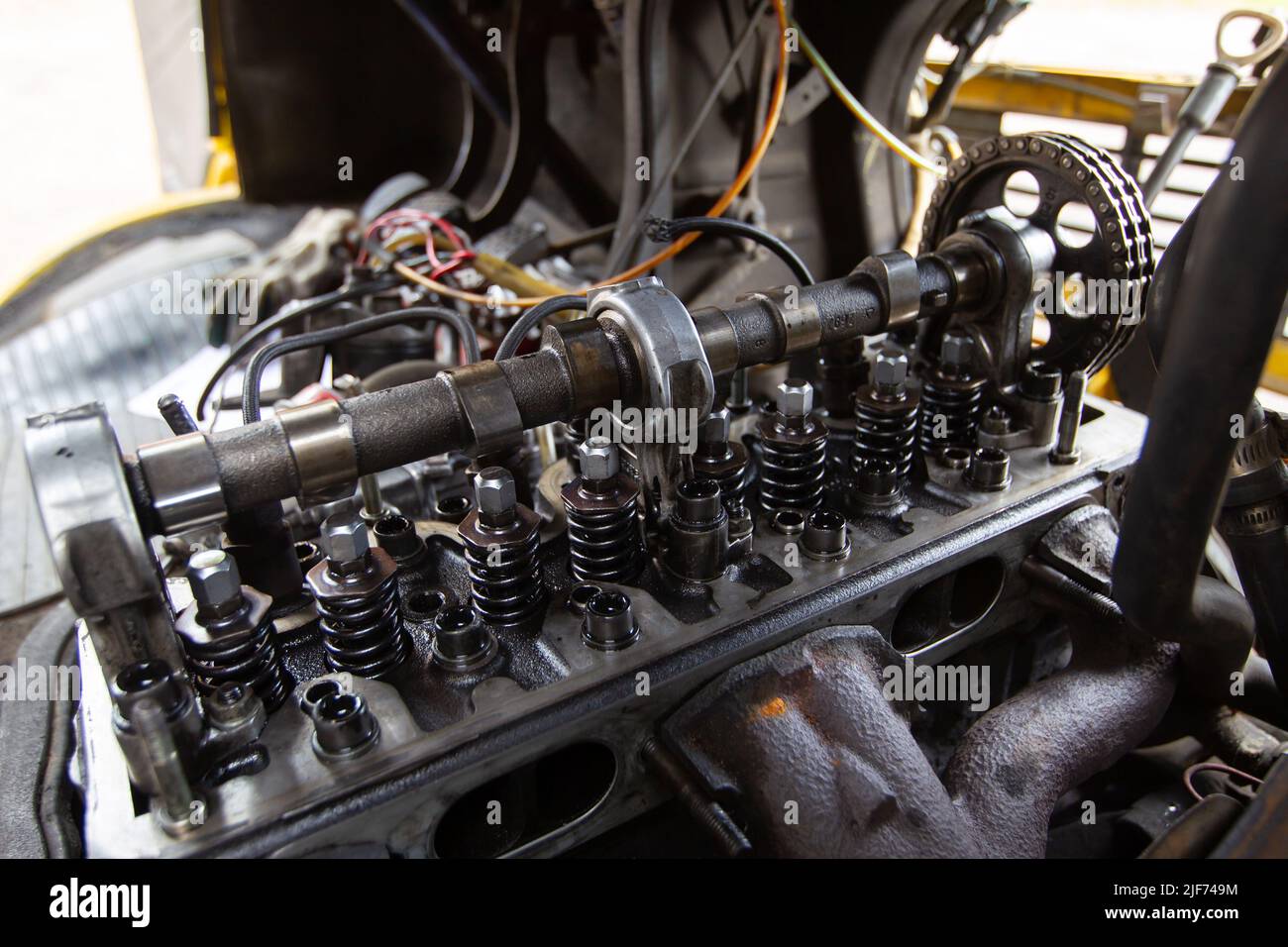 Mercedes diesel engine repair. Hands with a mechanic repairing Mercedes