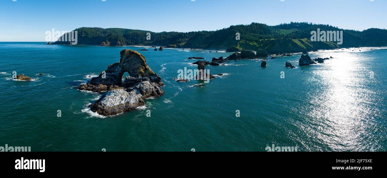 Basalt sea stacks lie just off the Northern Oregon shoreline, not far west of Portland. This part of the Pacific Northwest is absolutely beautiful. Stock Photo