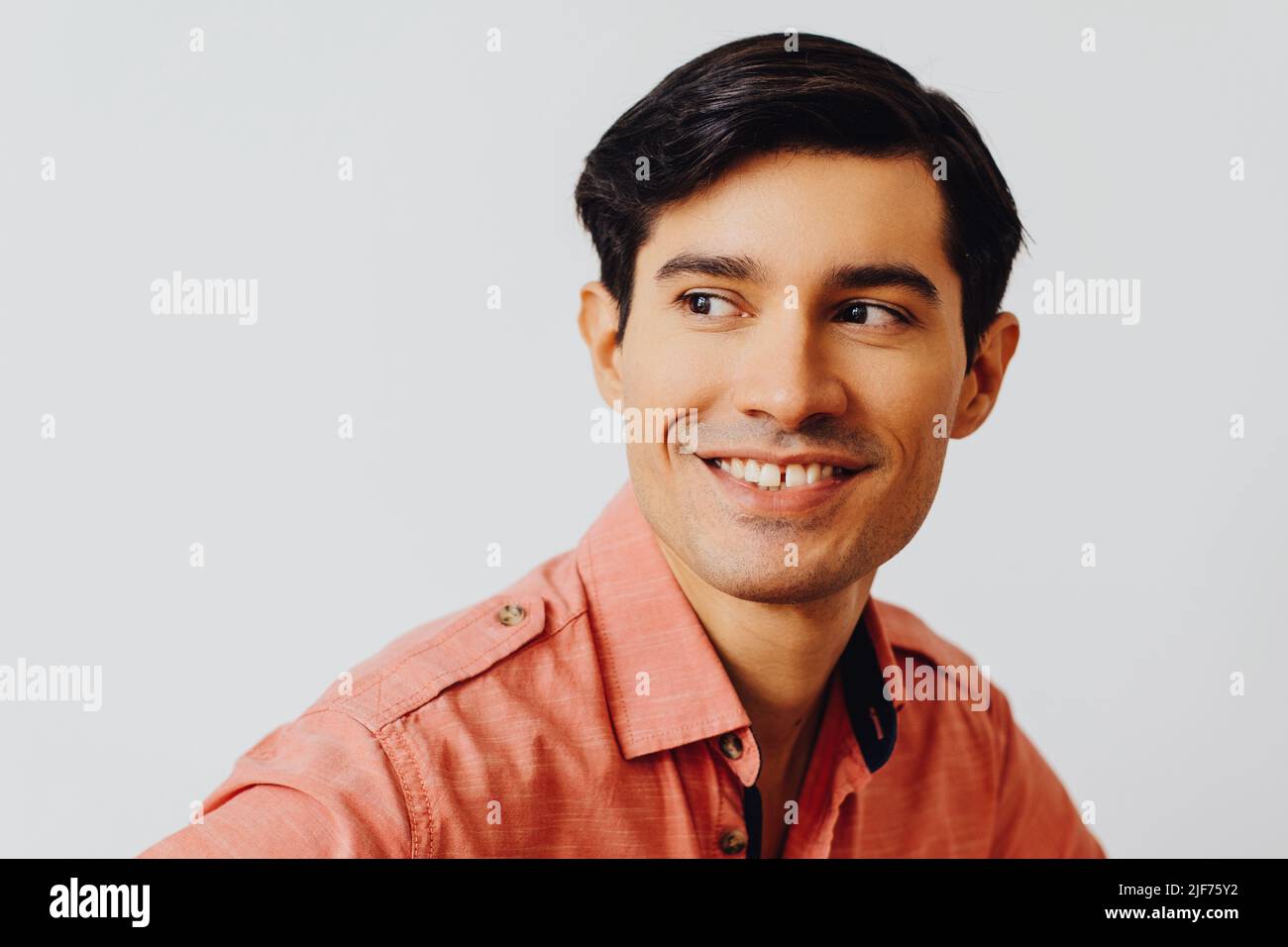 Headshot hispanic latino man black hair smiling handsome young adult