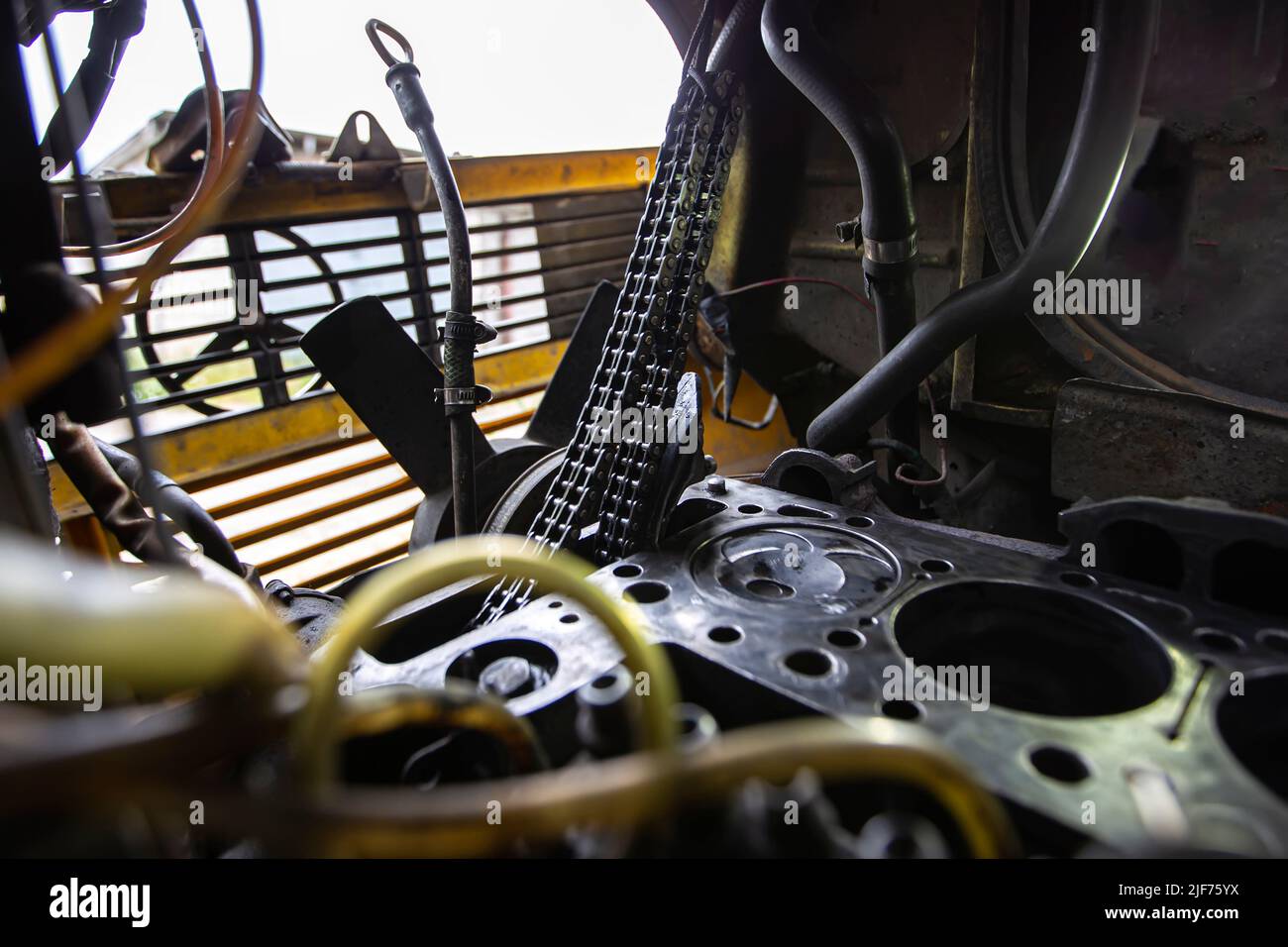 Main Engine Distribution Chain Mercedes diesel engine repair. Hands with a mechanic repairing Mercedes ...