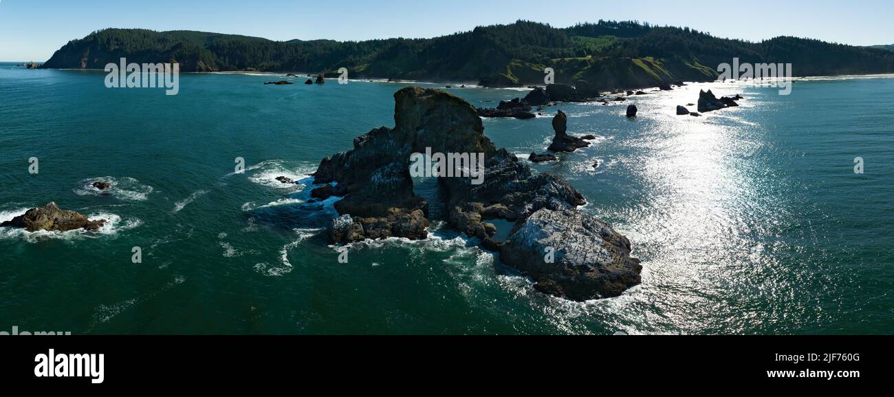 Basalt sea stacks lie just off the Northern Oregon shoreline, not far west of Portland. This part of the Pacific Northwest is absolutely beautiful. Stock Photo