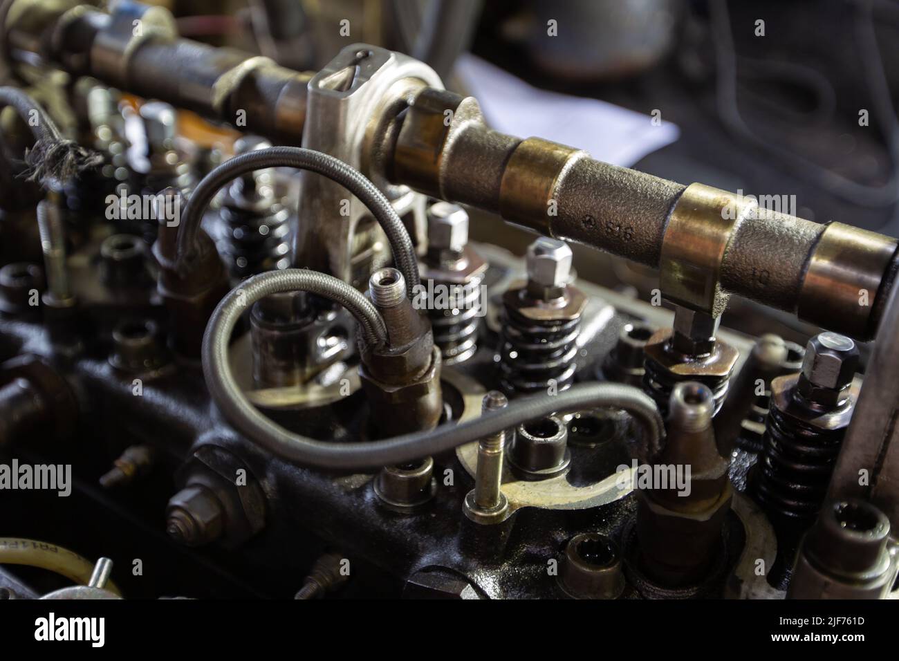 Mercedes diesel engine repair. Hands with a mechanic repairing Mercedes