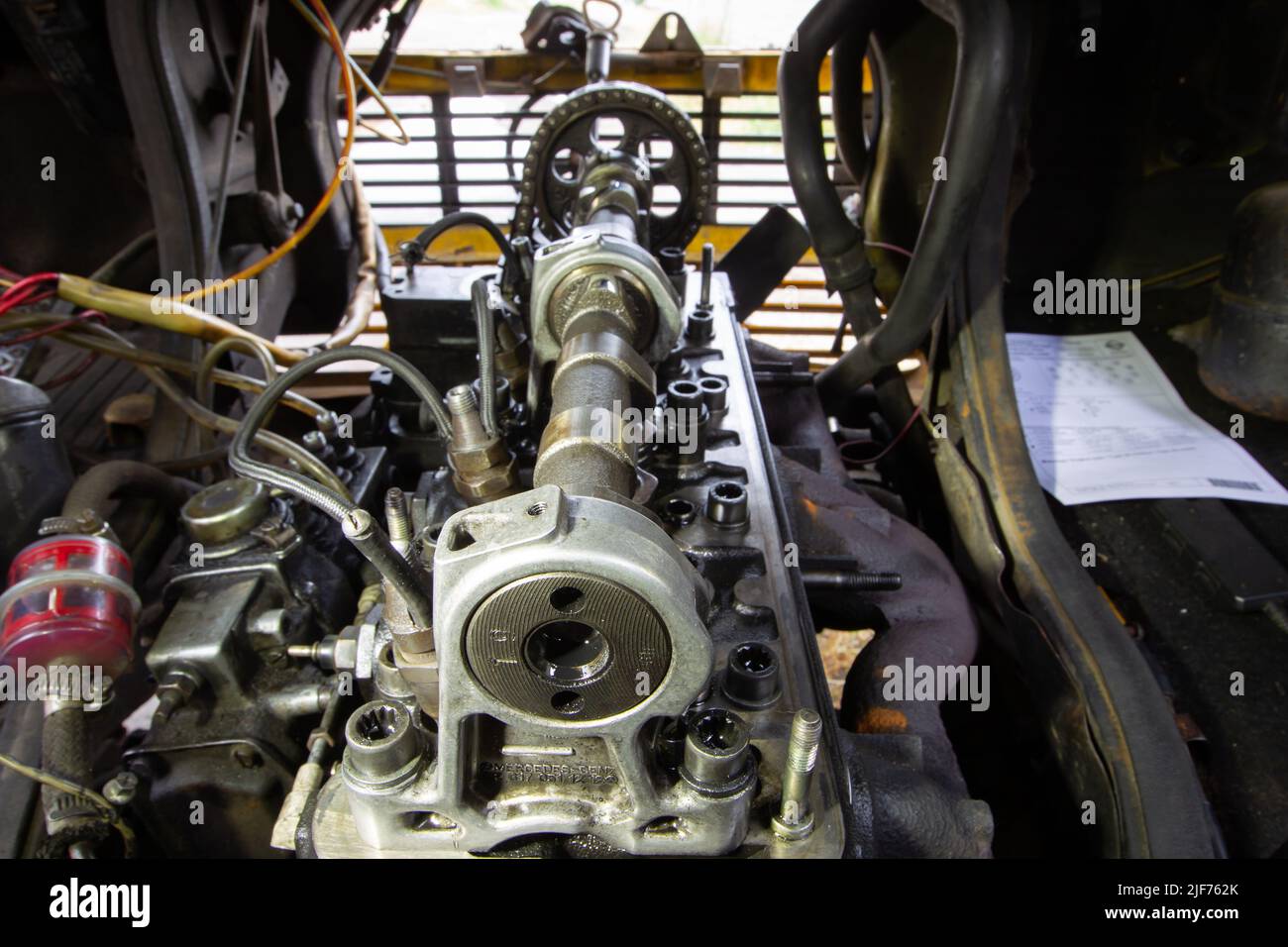 Mercedes diesel engine repair. Hands with a mechanic repairing Mercedes