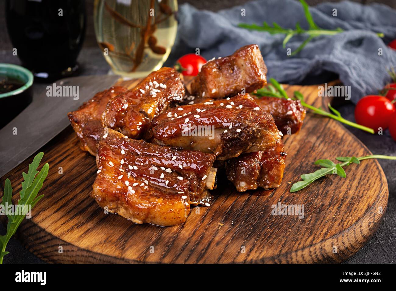 Grilled sliced ribs in sweet and sour sauce. Ribs marinated in honey